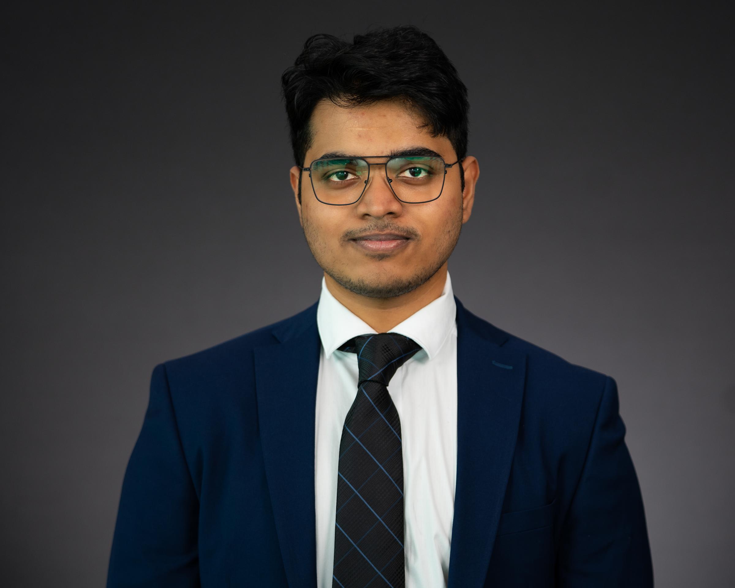 Headshot of Vedant Vijay Shinde wearing professional attire.