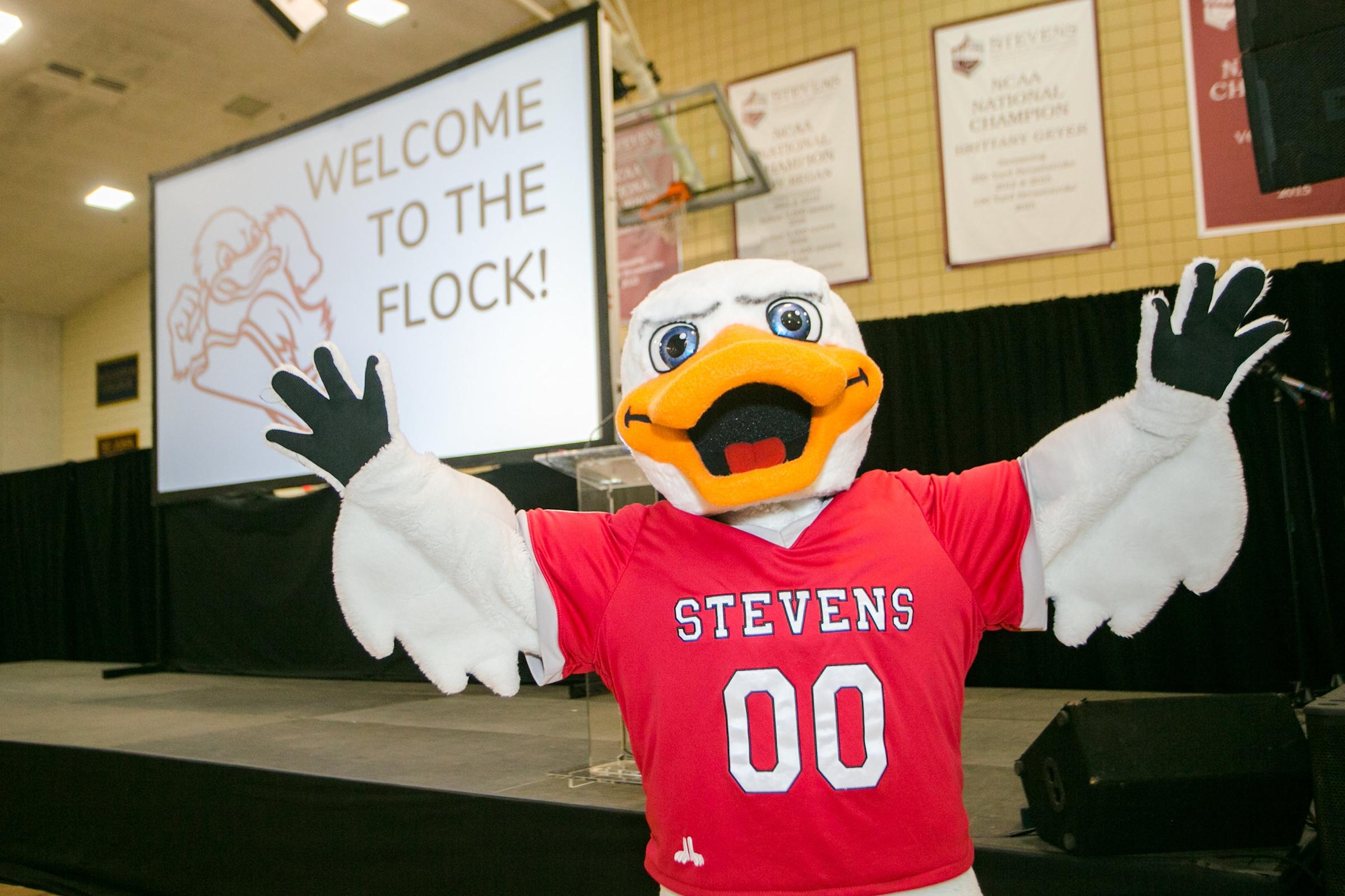 Attila with Welcome to the Flock projection in Gymnasium