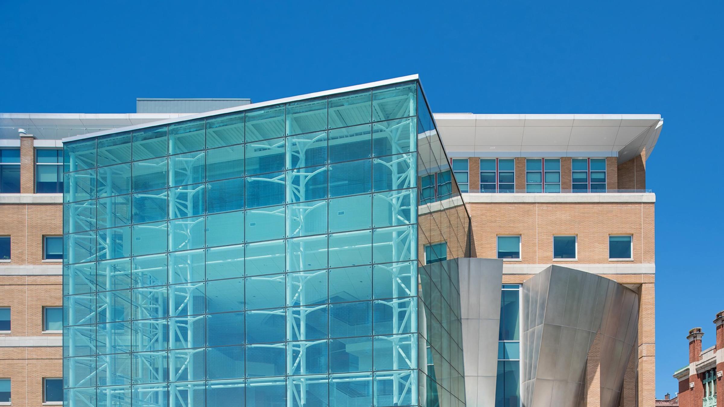 Groups of students gather outside the Babbio Center on the Stevens campus.