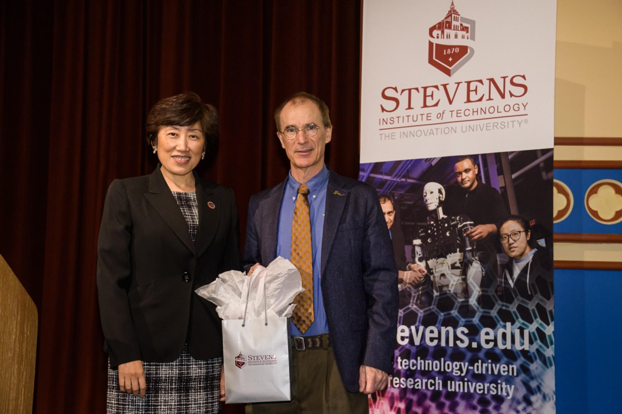 CAPTION: Schaefer School of Engineering and Science Dean Jean Zu and C. Randy Giles. CREDIT: Jeff Vock.