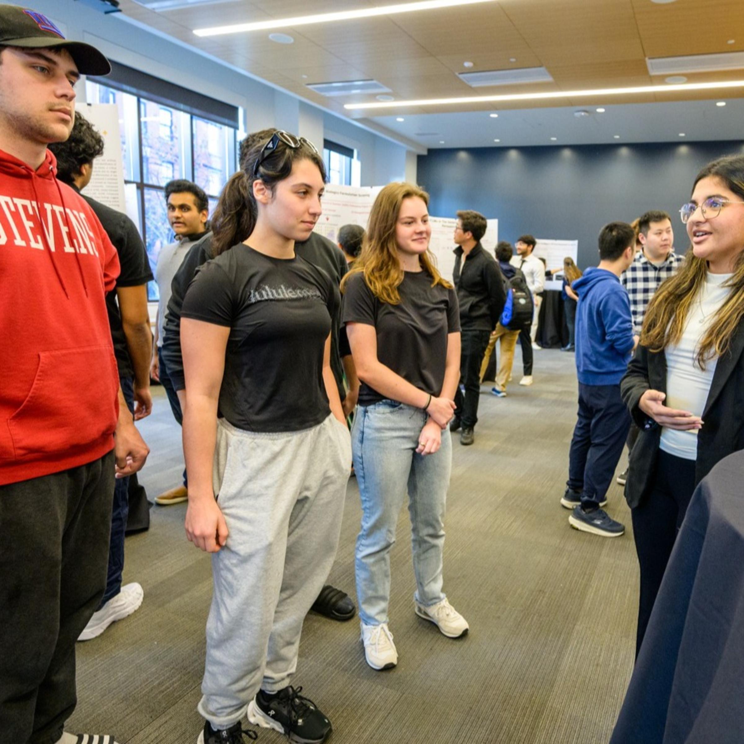 Stevens students viewing a student presentation.