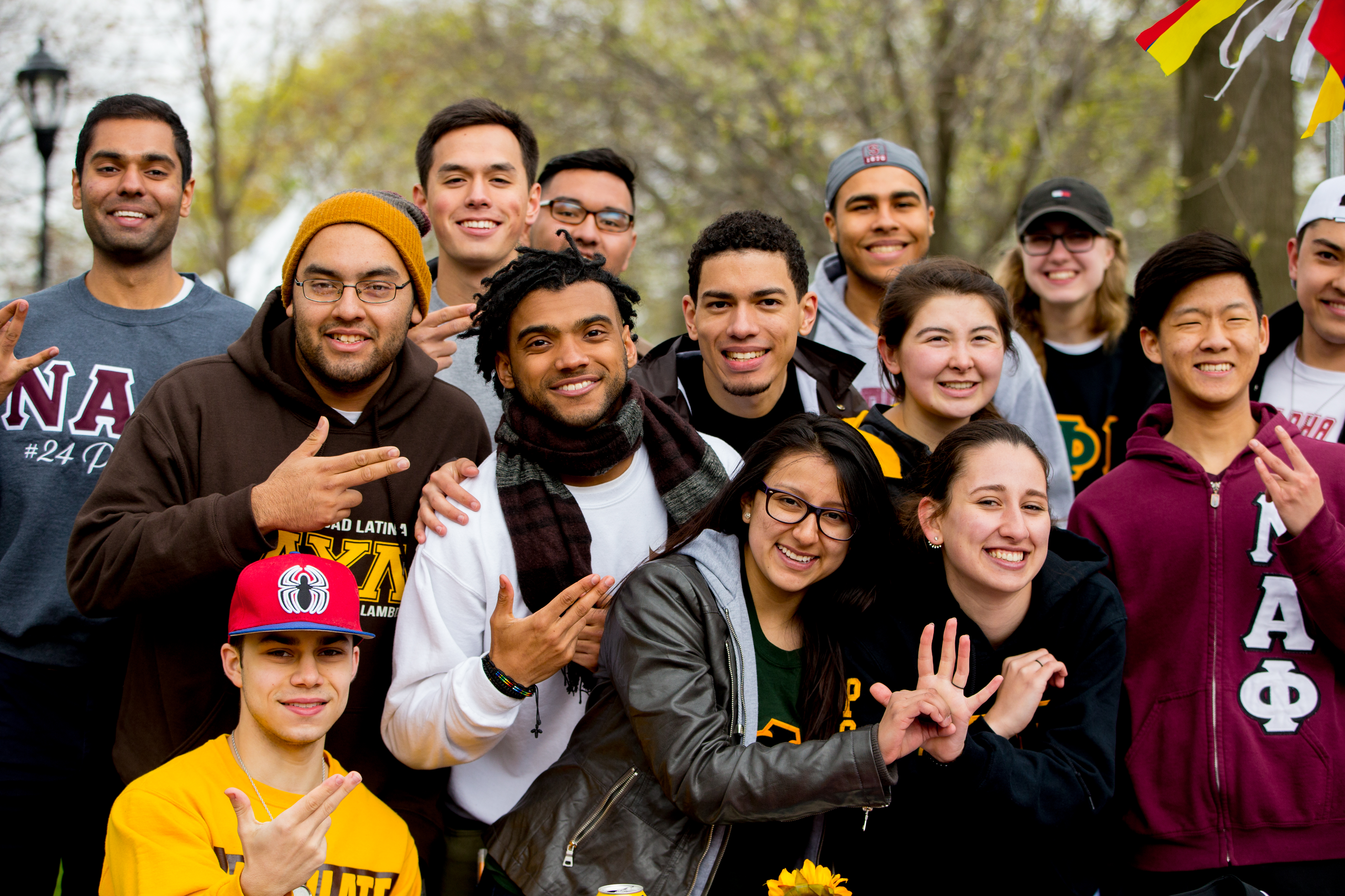 A group of fraternity and sorority members smiling