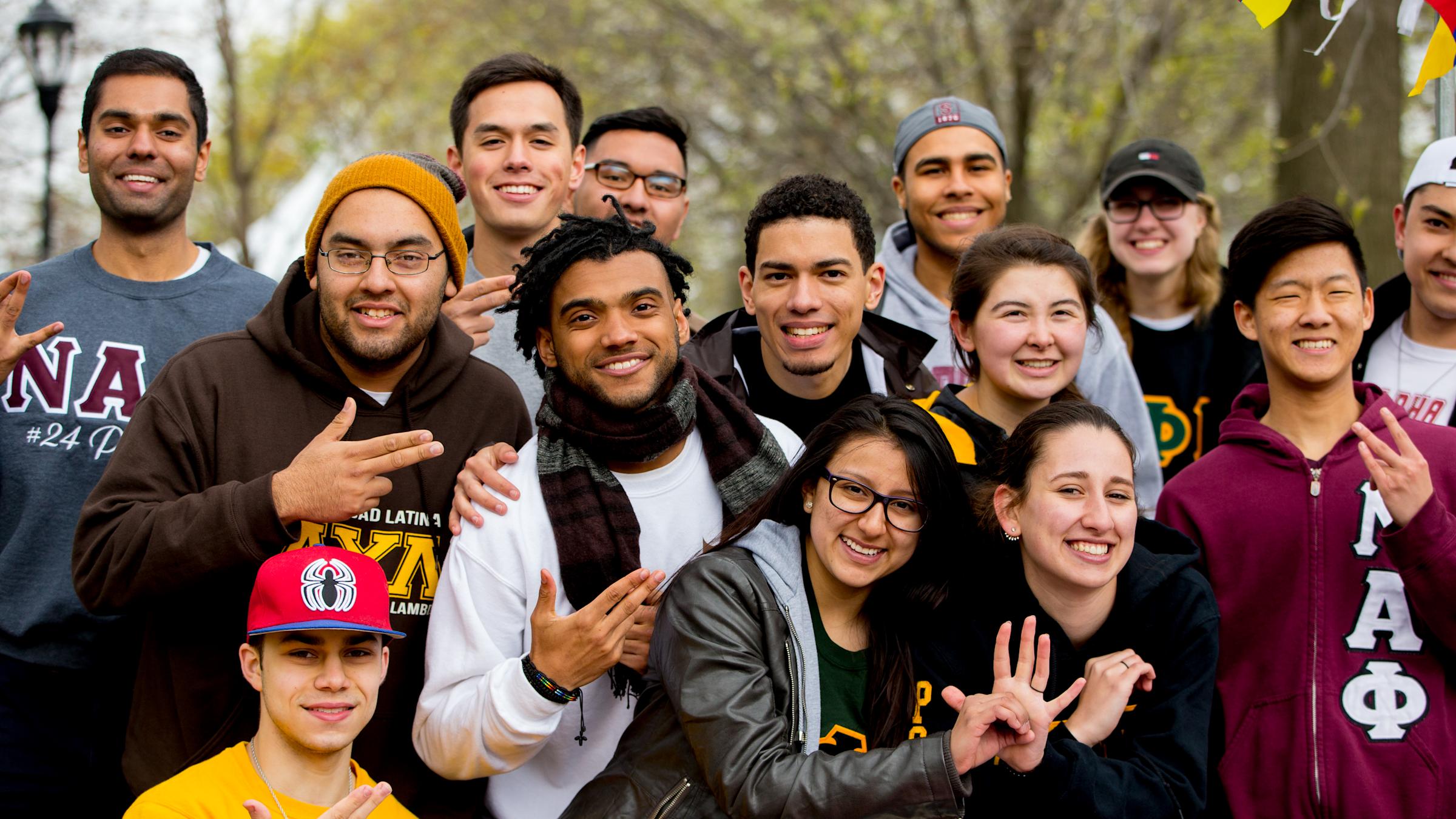 A group of fraternity and sorority members smiling