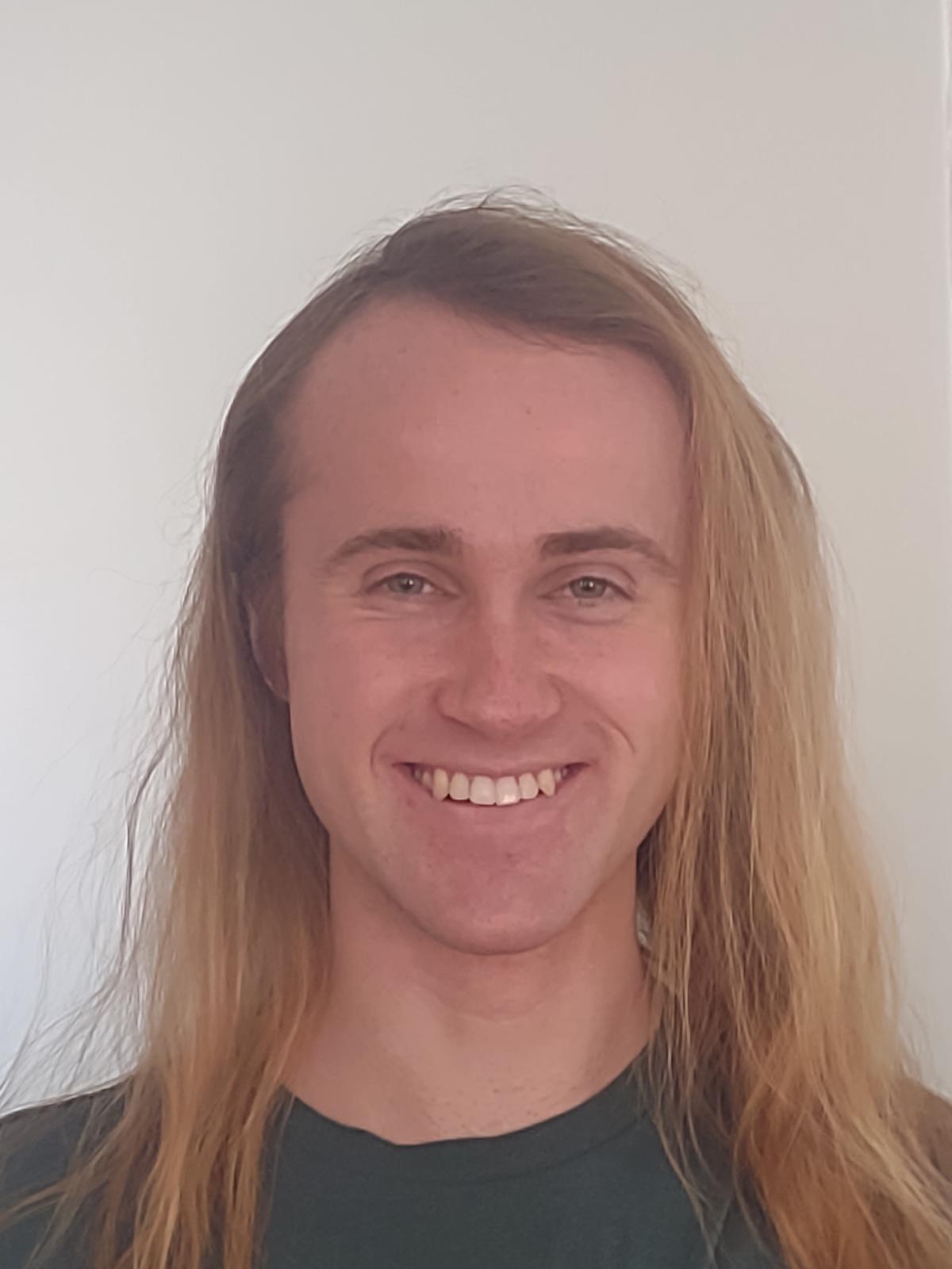 A headshot of a man