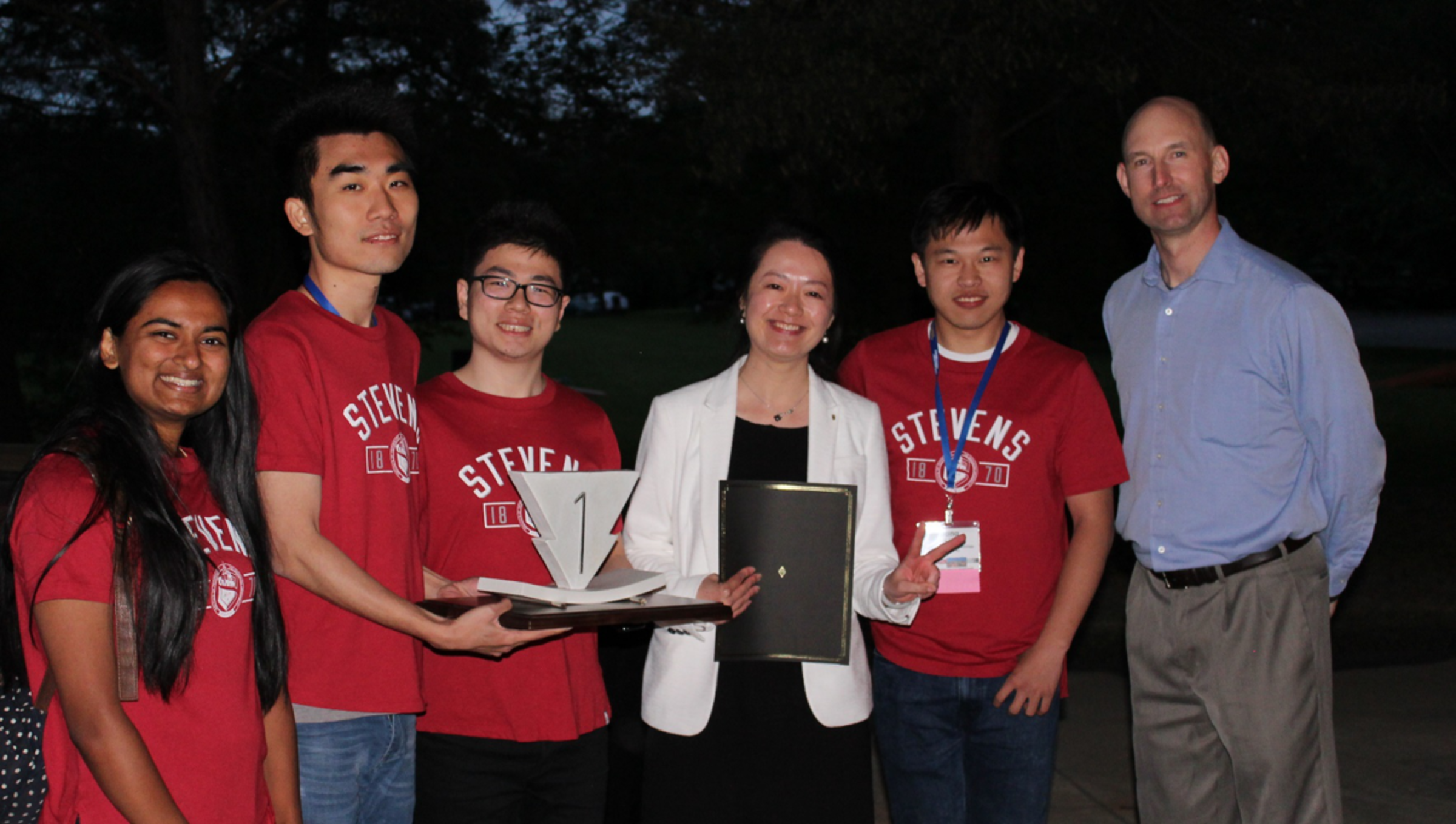 Weina Meng standing with a team of students at the 2nd International Symposium of Ultra-High-Performance Concrete (UHPC)