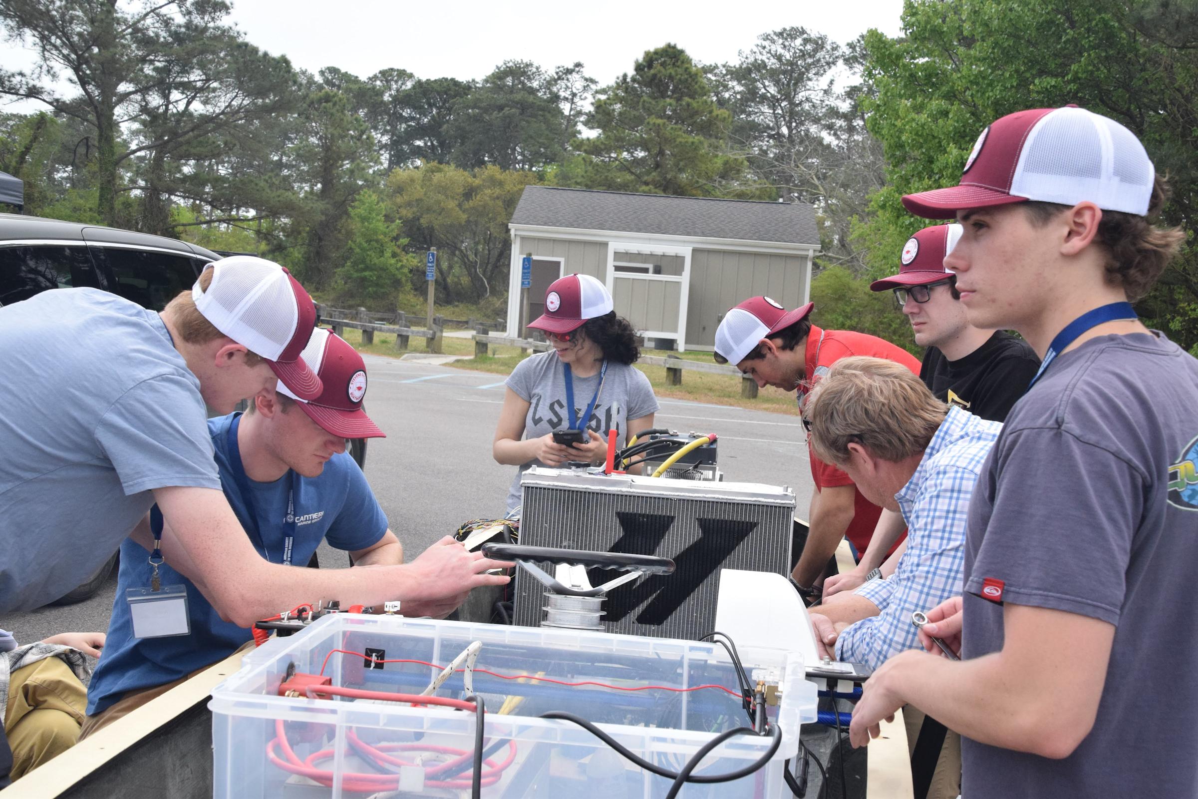 As a founding member of the Stevens Electric Boatworks team, Lossman (back center) helped work on the eboat’s motor controller before the team won the 2025 American Society of Naval Engineers’ Promoting Electric Propulsion competition in Virginia.