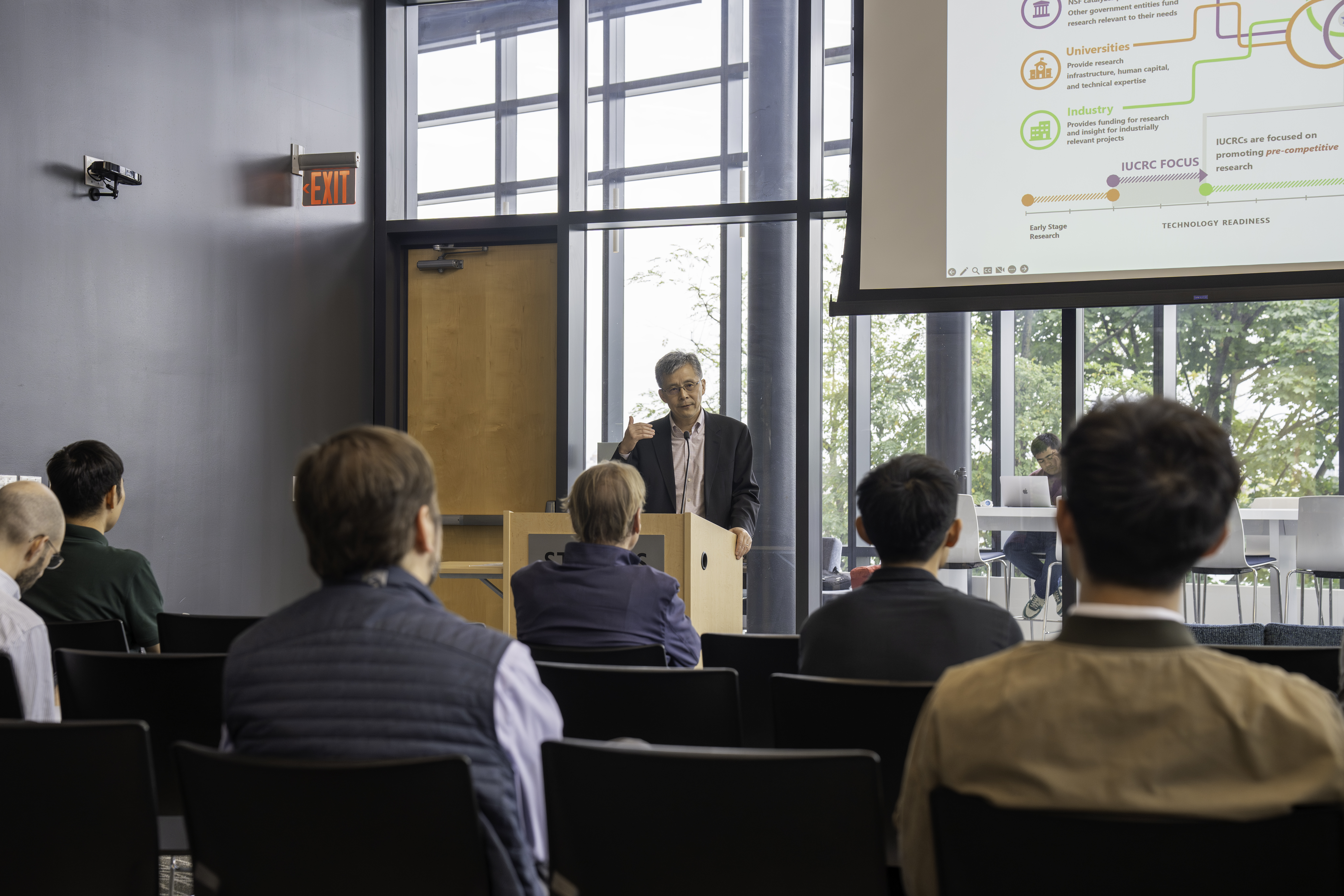 Dr. Steve Yang speaking at podium
