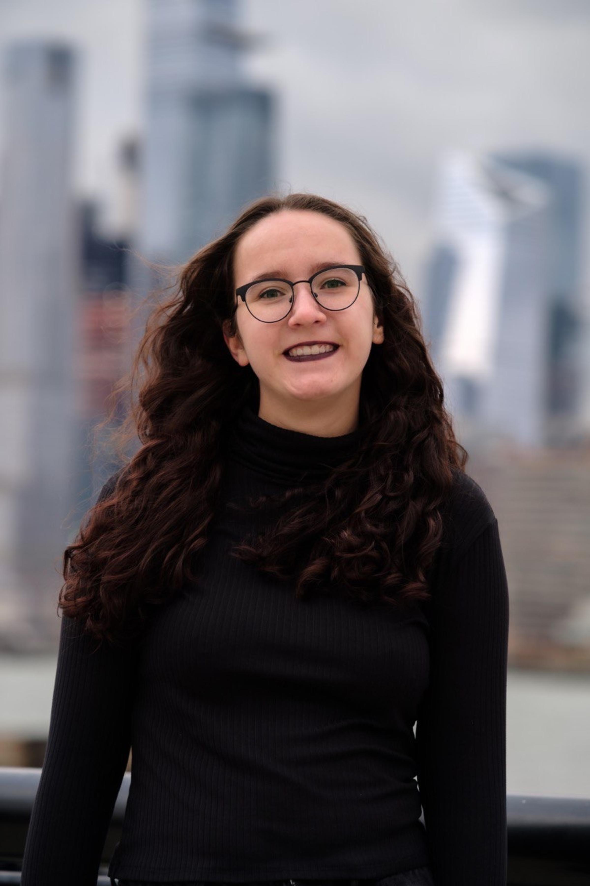 Rachel Cipkins '22 with the NYC skyline in the background