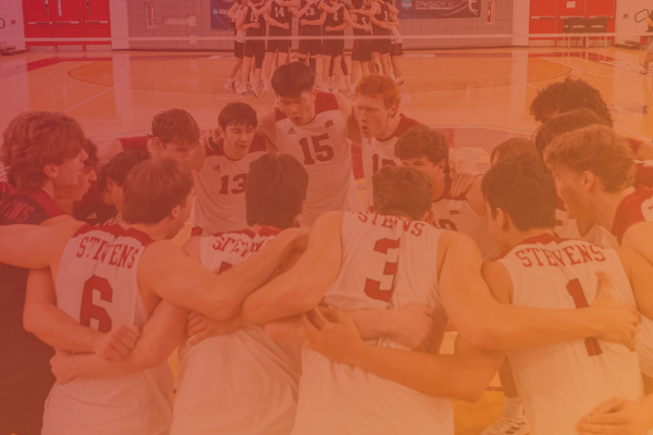 Men's basketball team huddles on court