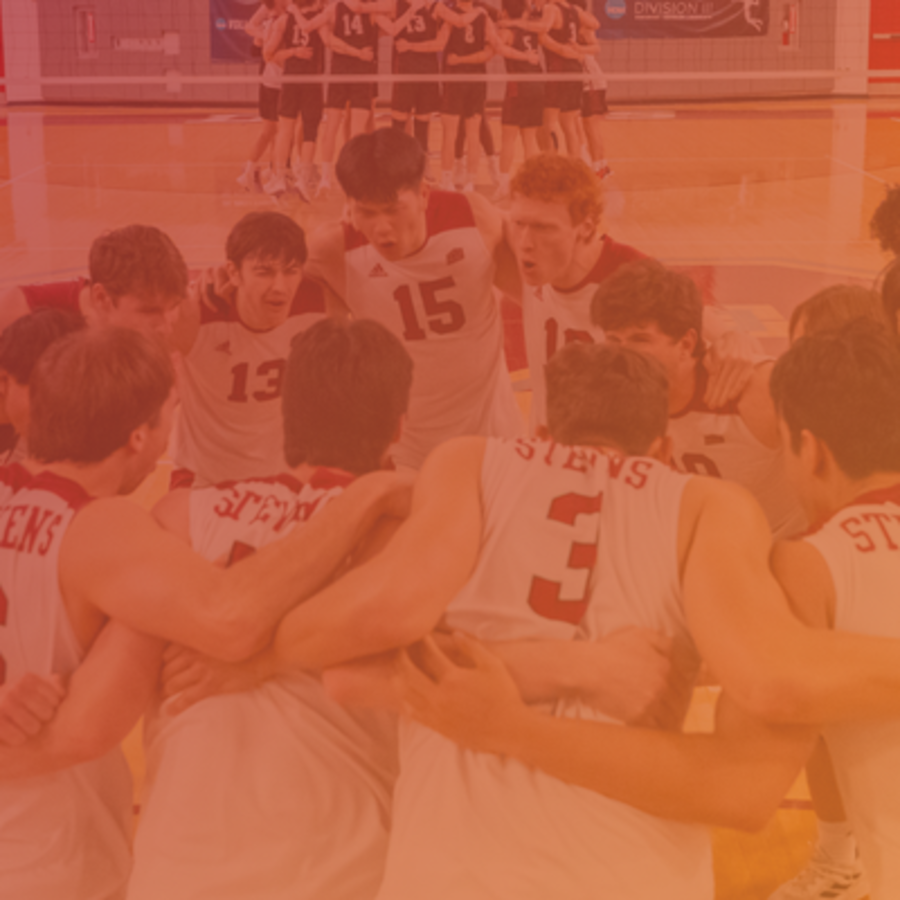 Men's basketball team huddles on court