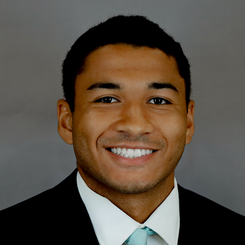 Headshot of Tyler Warren wearing professional attire. 