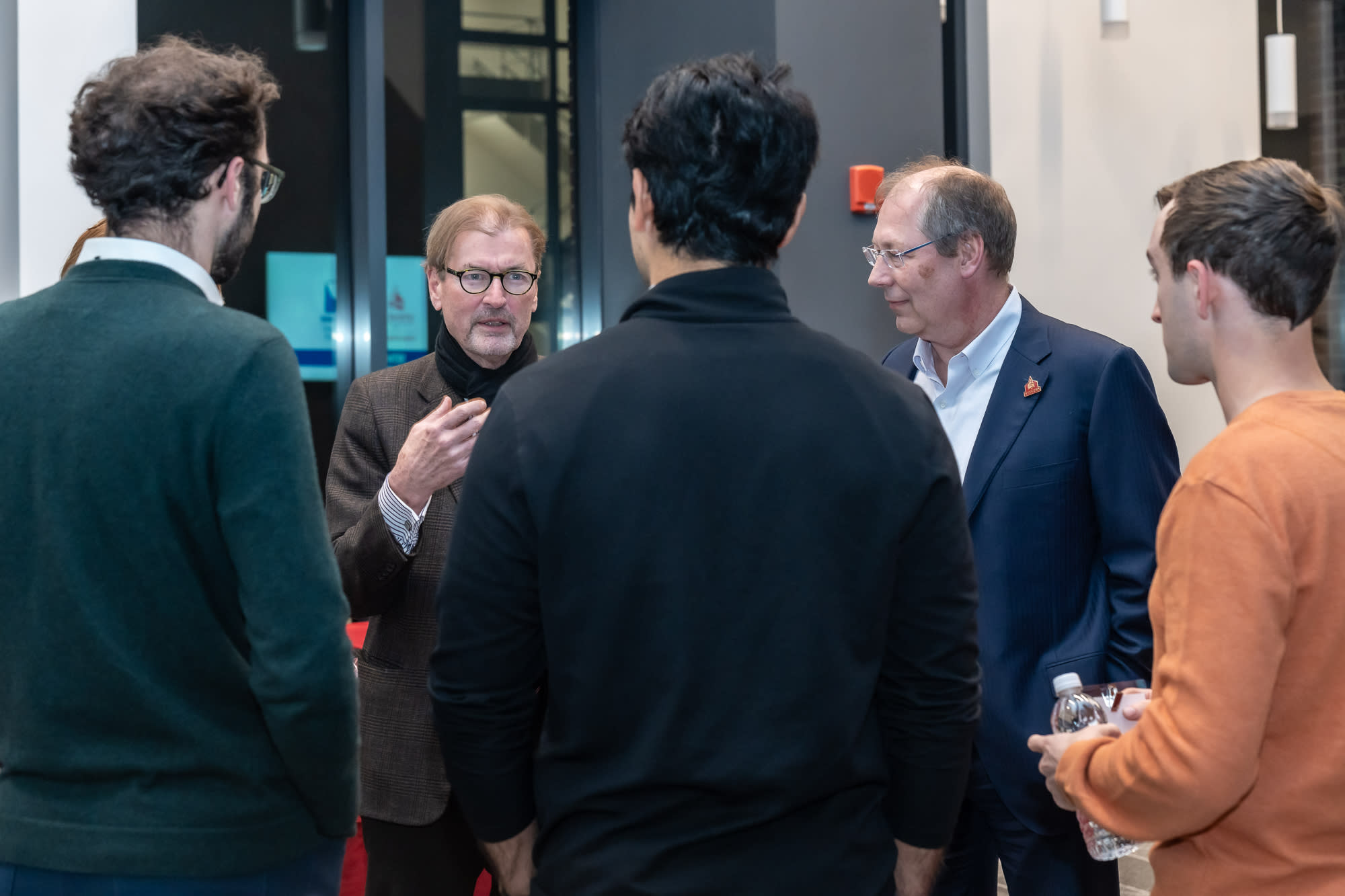 George Calhoun talks to a group of people