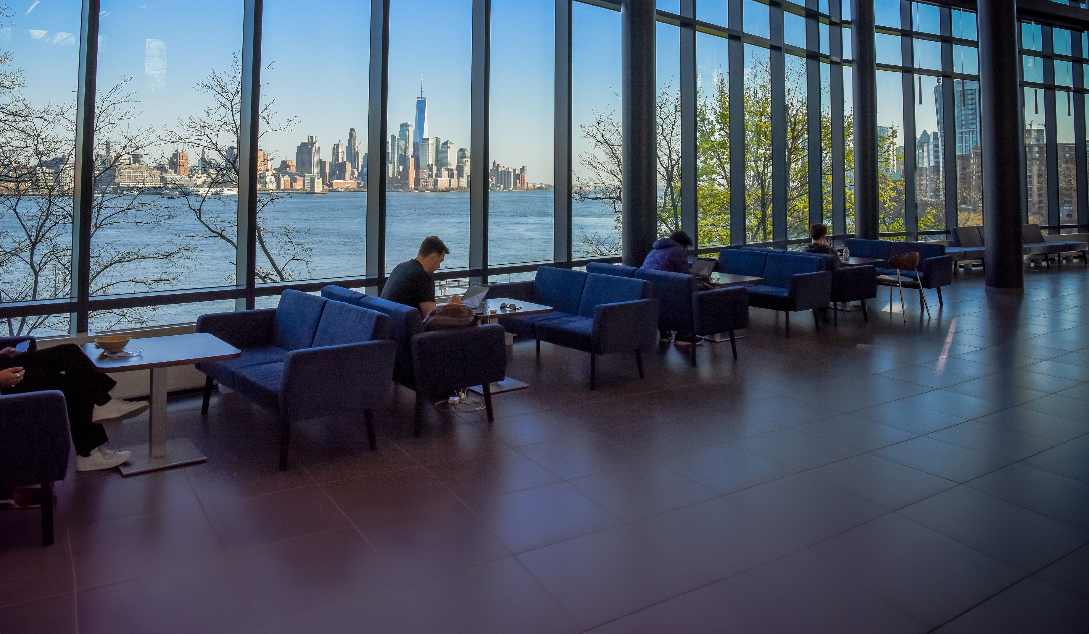Students studying with NYC skyline in the background