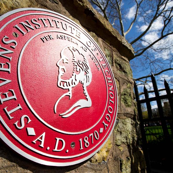 Stevens big, red, round seal. On seal, in rounded lettering, it says, Stevens Institute of Technology 1870 A.D. Per Apera ad Astera.
