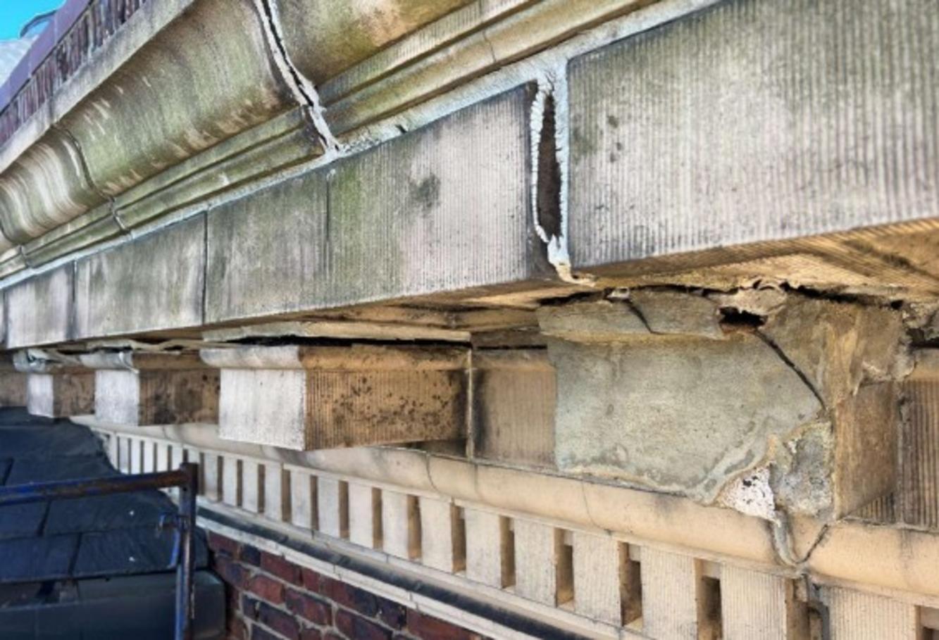 Cornice reconstruction at west and south elevations, before restoration