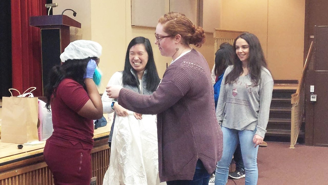 Brensinger Elementary student tries on a cleanroom suit.