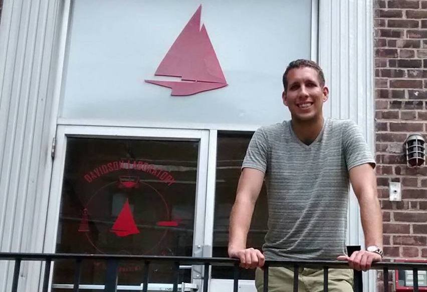 Postdoctoral researcher Justin Schulte standing outside the Davidson Laboratory