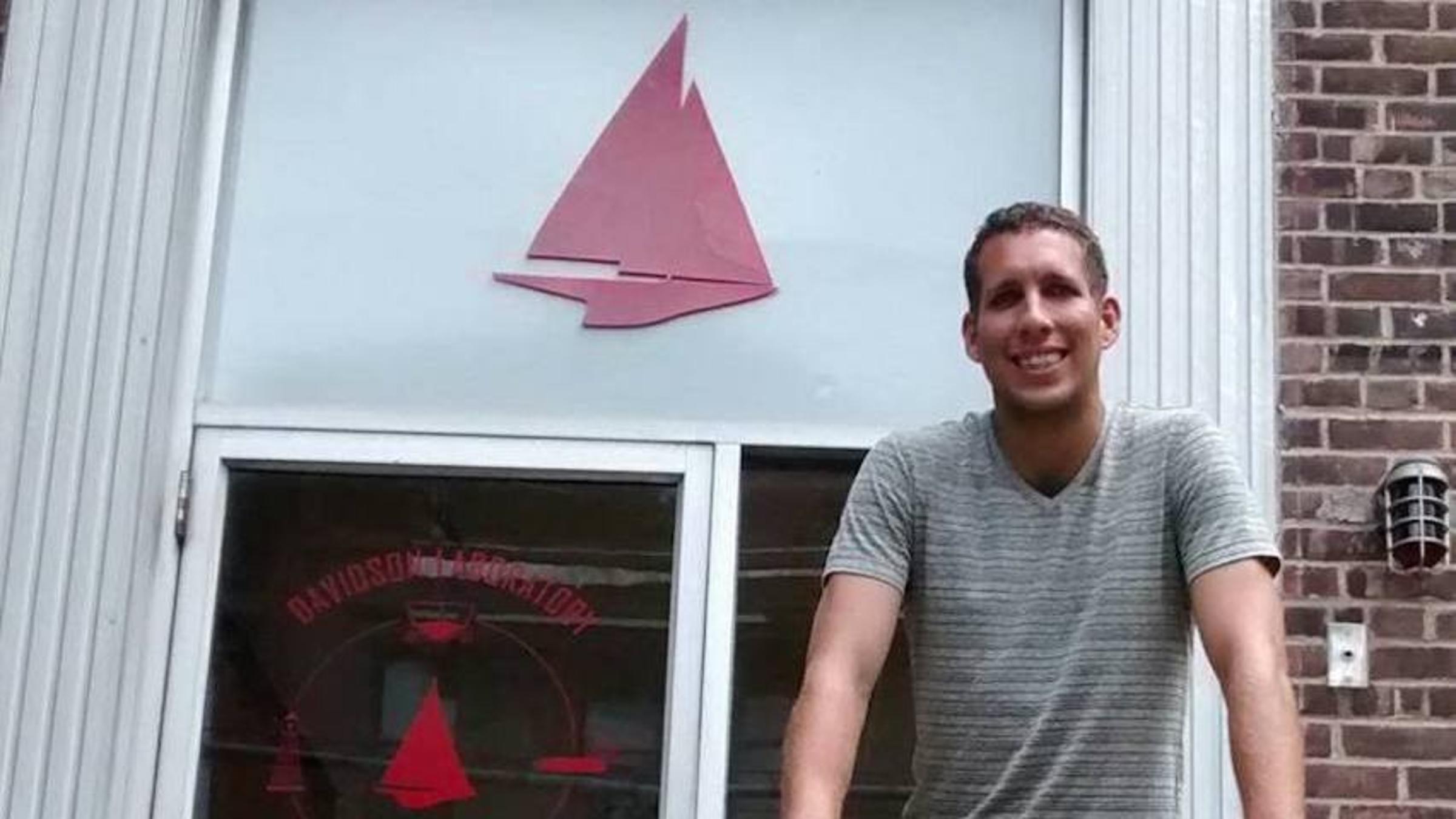 Postdoctoral researcher Justin Schulte standing outside the Davidson Laboratory