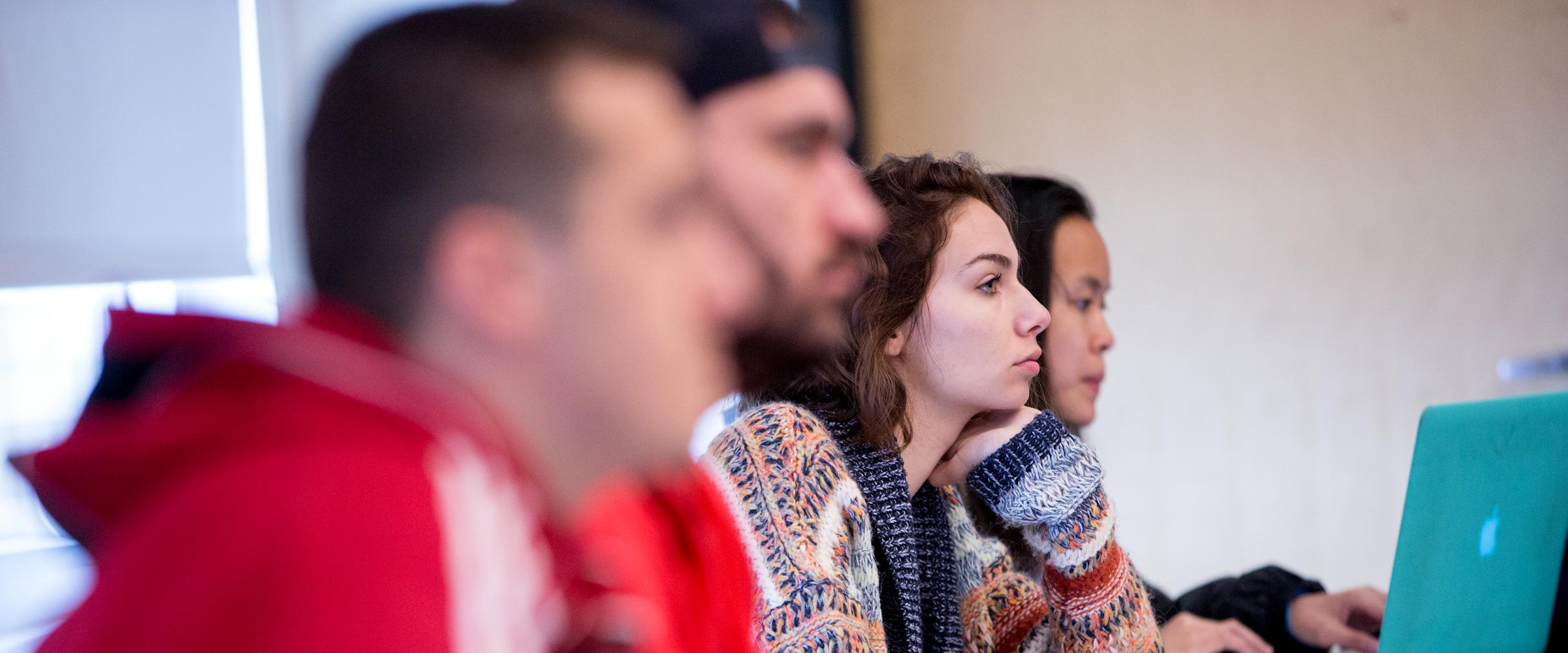Students listen intently to lecture.