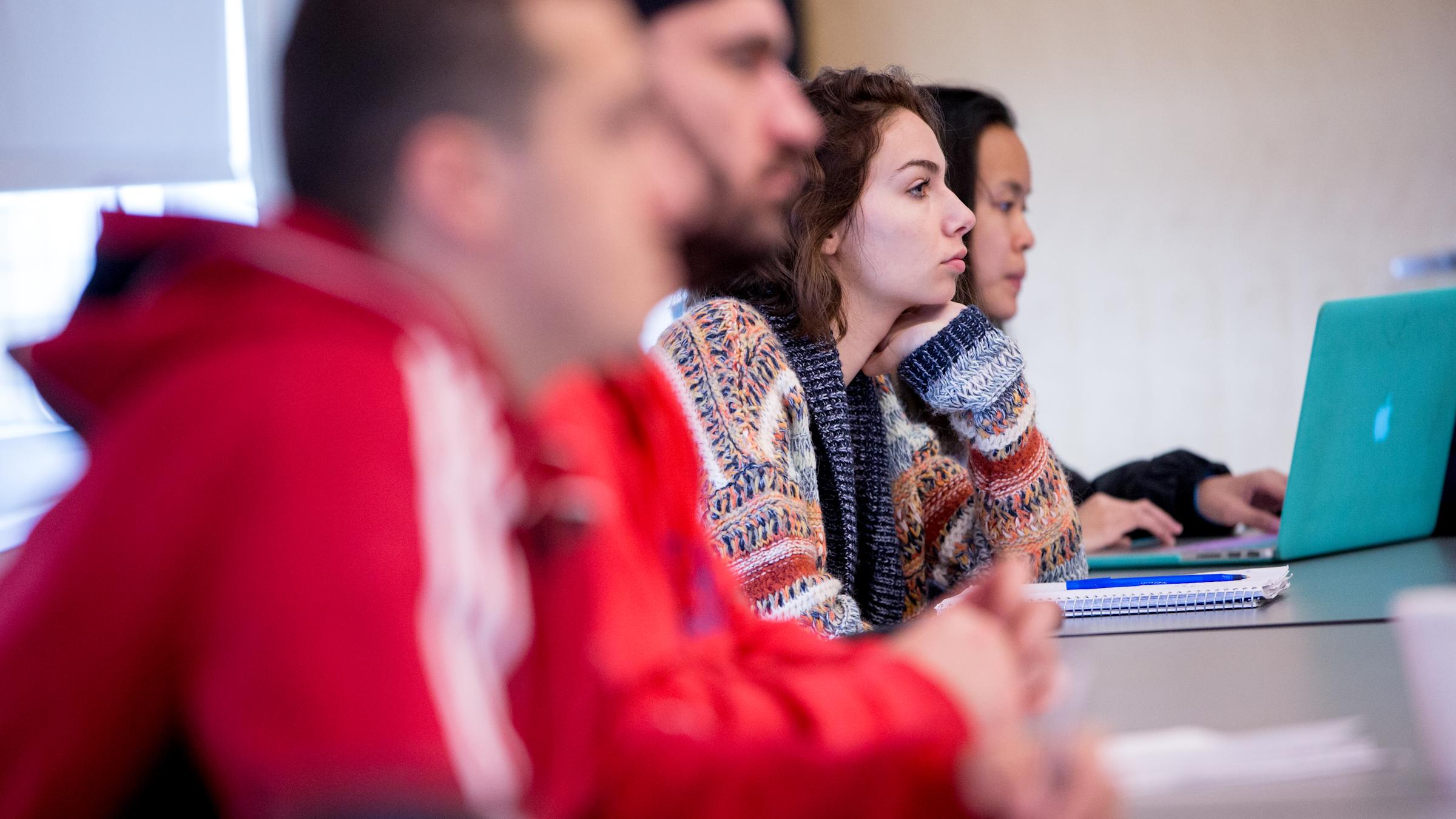 Students listen intently to lecture.