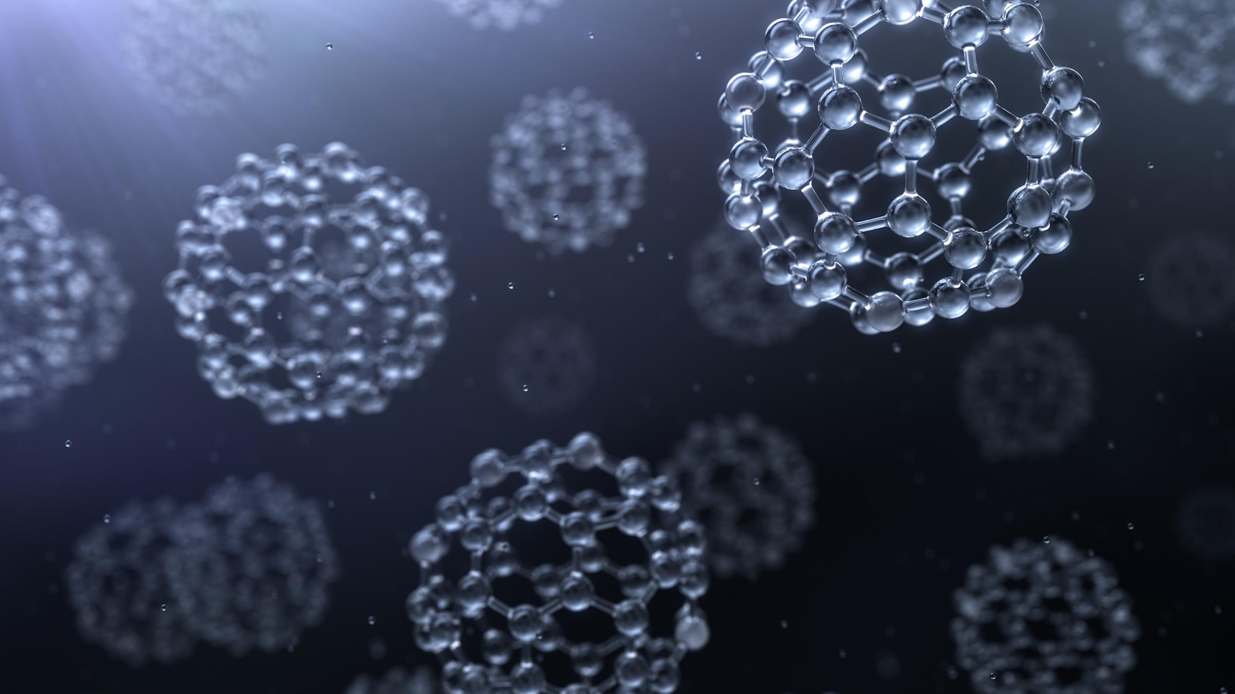 An illustration of nanoparticles, which look like molecular structures in the shapes of spheres.