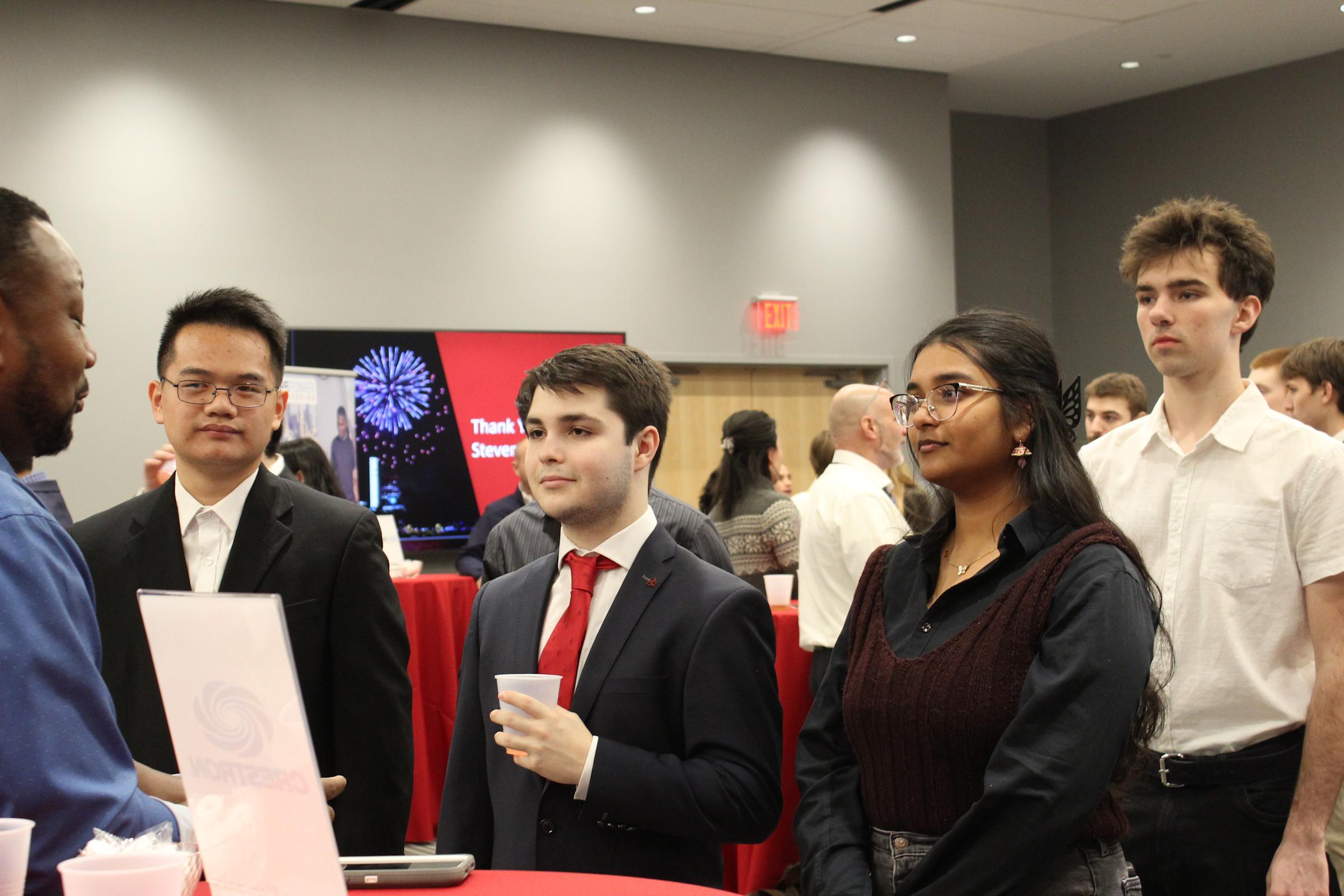 Student shaking a hand wit employer 