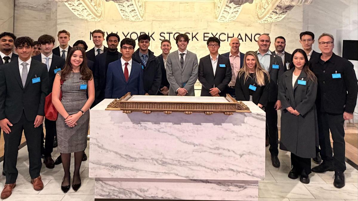 The Stevens team and other students from the competition at the New York Stock Exchange.