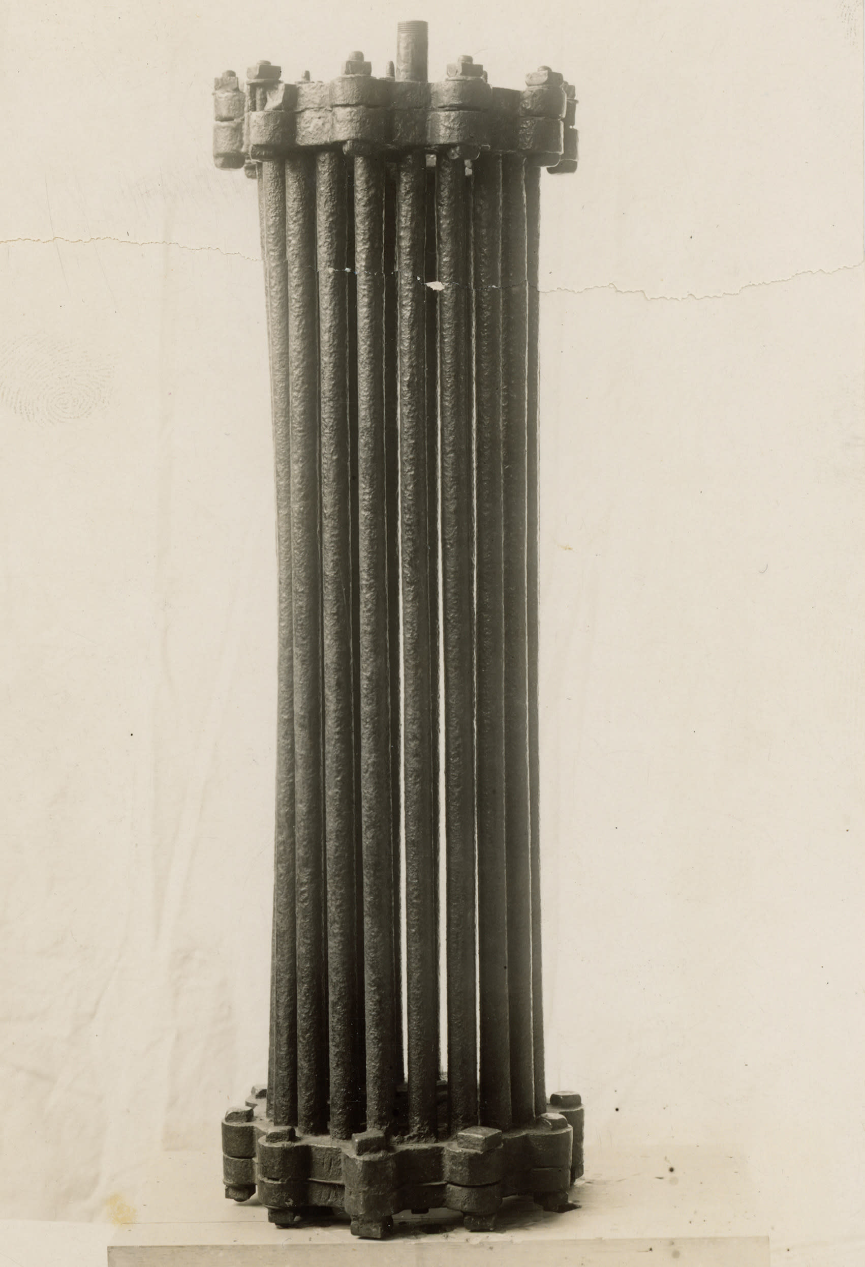Black and white photo of an old boiler, which is a series of tubes.