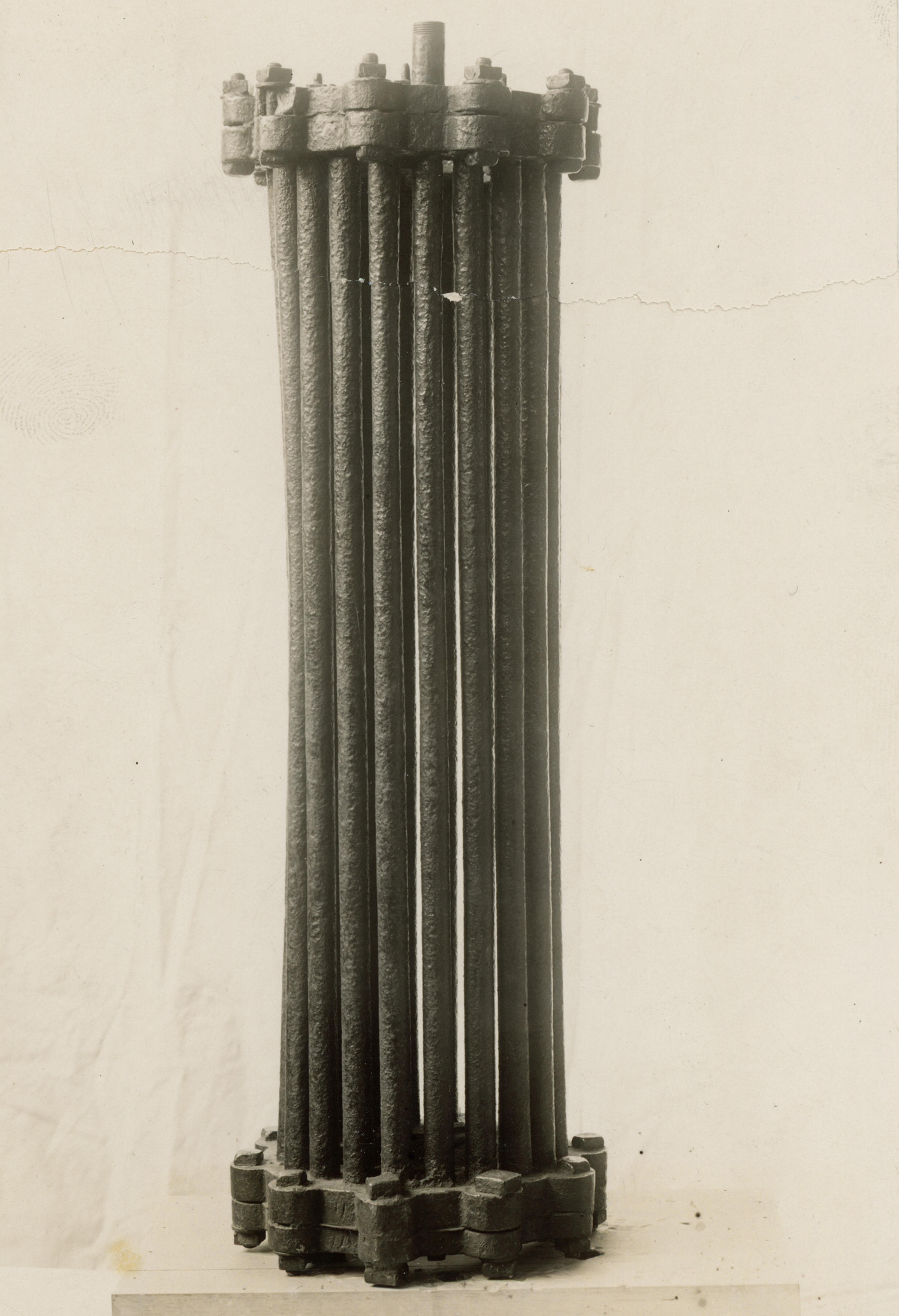 Black and white photo of an old boiler, which is a series of tubes.