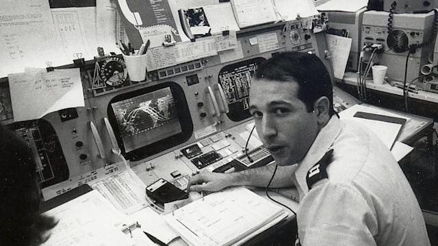 Black and white photo of Paul Porzio ’77 at Mission Control for NASA in 1982