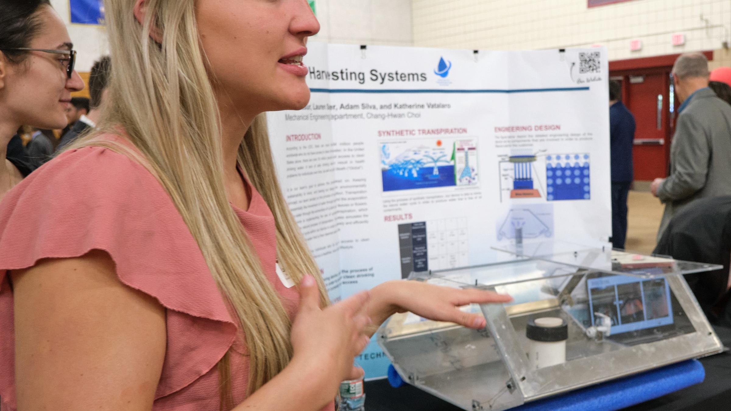 Woman student presents her work at the Innovation Expo