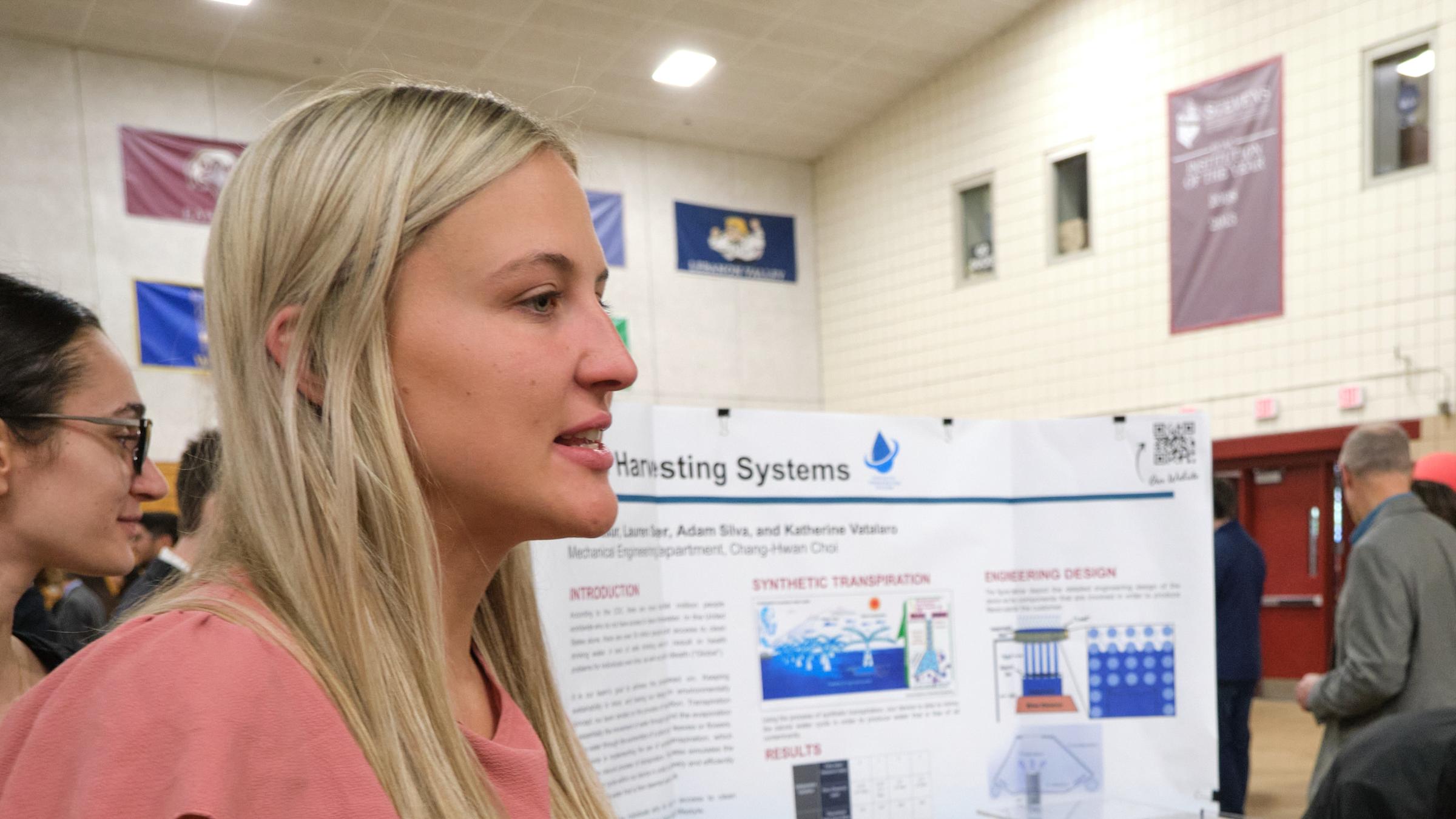 Woman student presents her work at the Innovation Expo