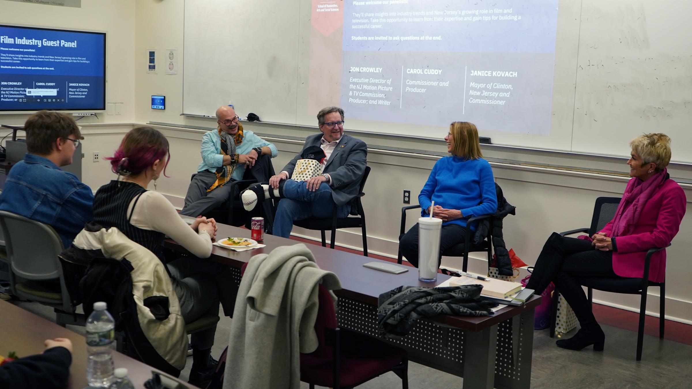 Jon Crowley, David W. Schoner, Jr., Carol Cuddy, Janice Kovach speaking at a student panel