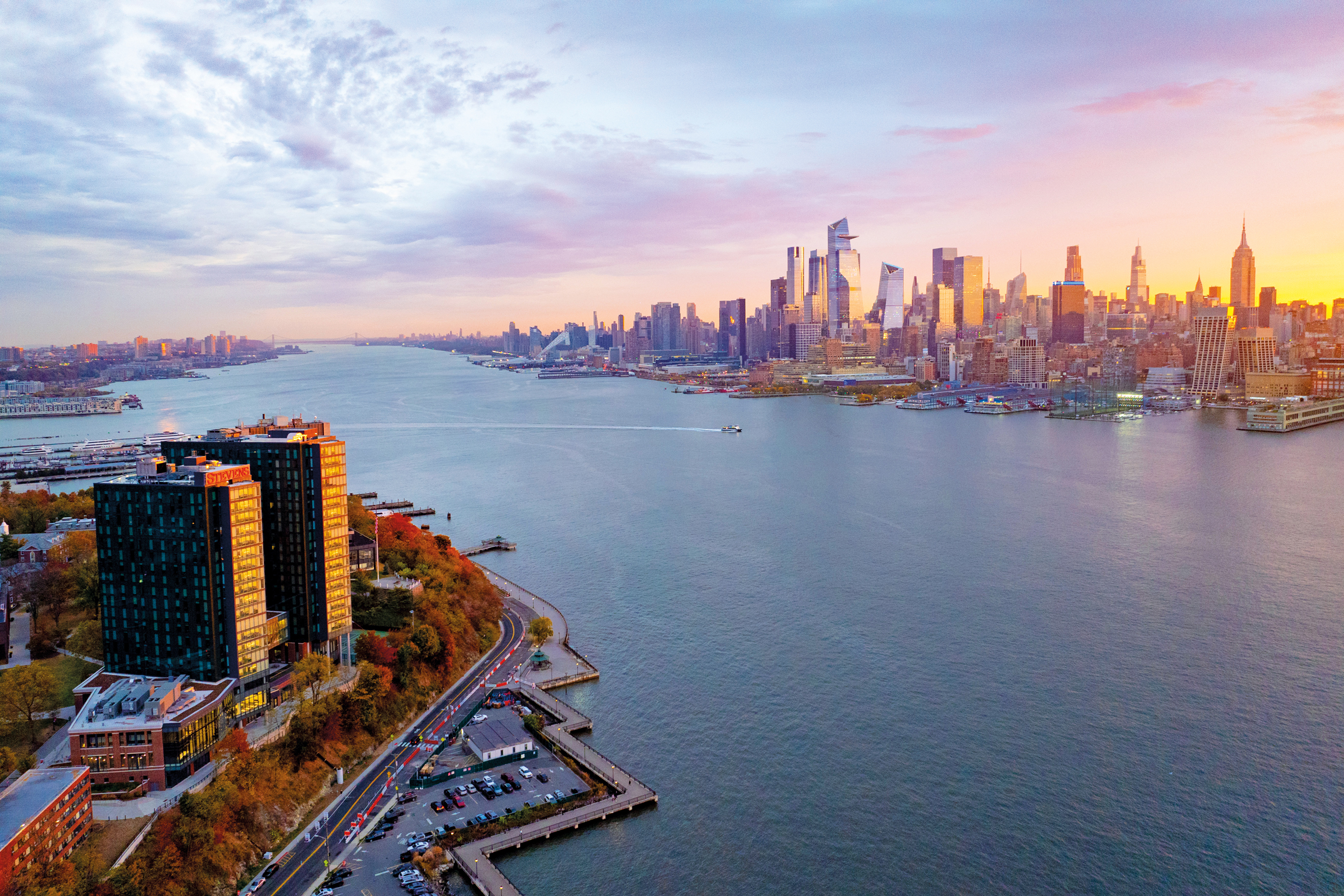 New York skyline at dusk with Stevens campus in the foreground