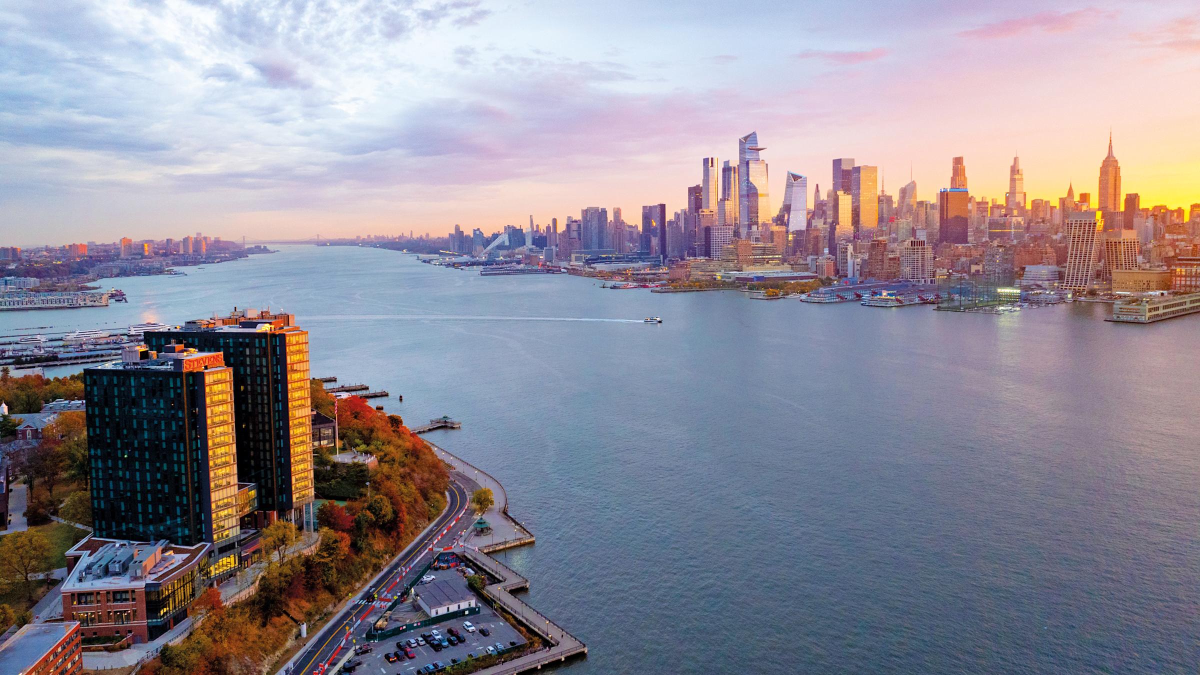 New York skyline at dusk with Stevens campus in the foreground