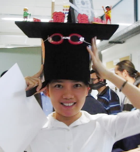 Image of professor Jia Xu with fanciful hat