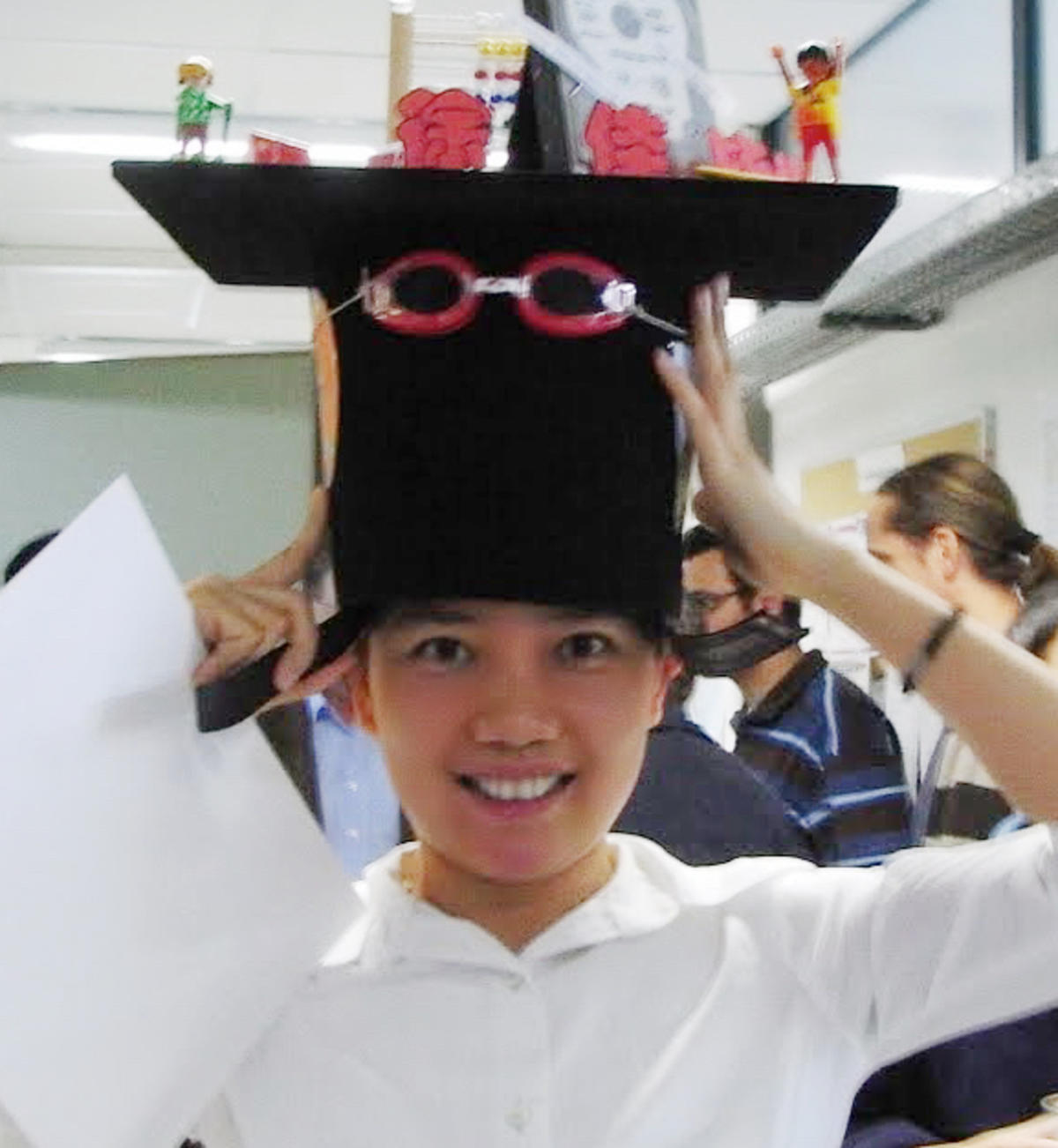Image of professor Jia Xu with fanciful hat