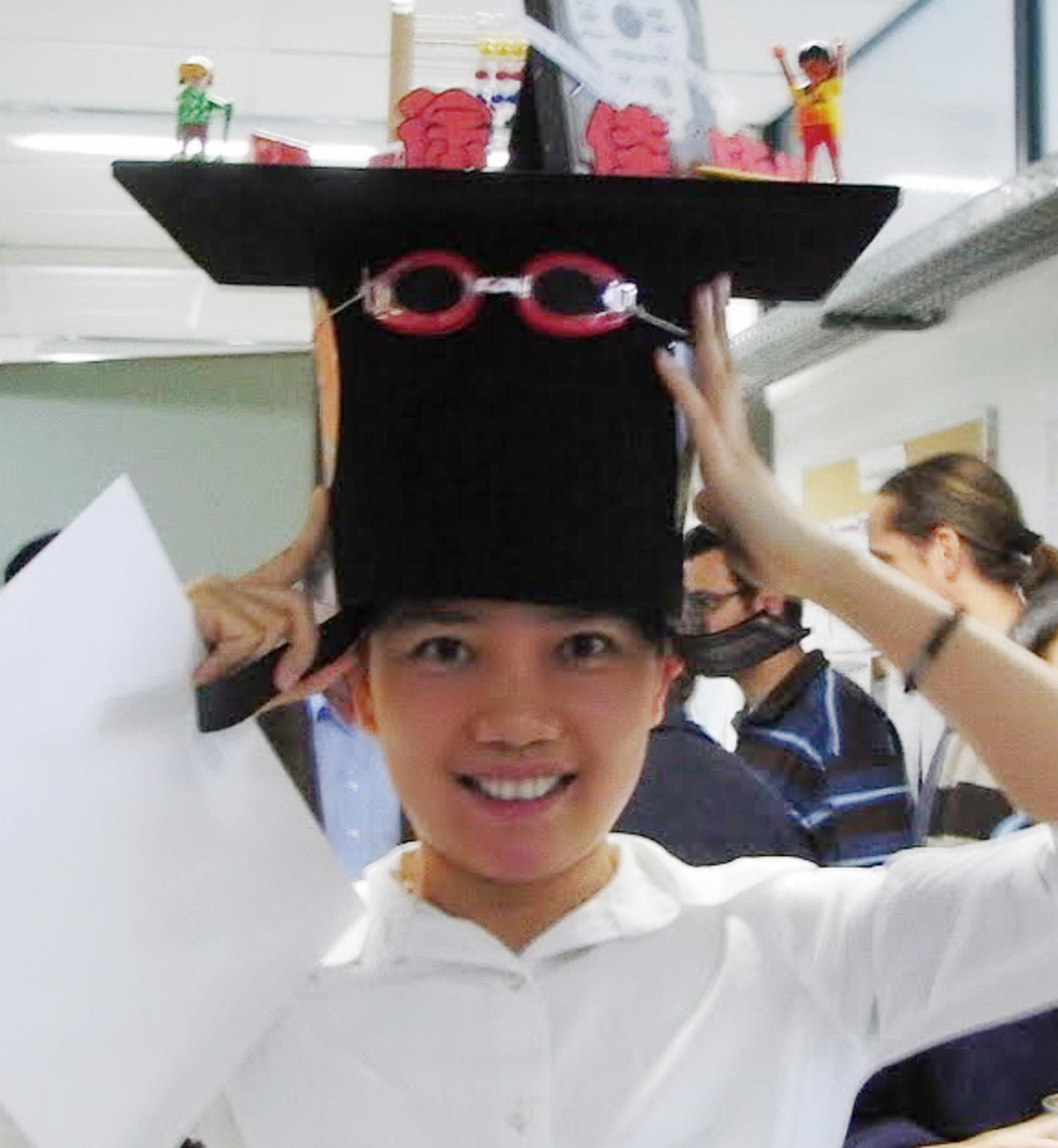 Image of professor Jia Xu with fanciful hat