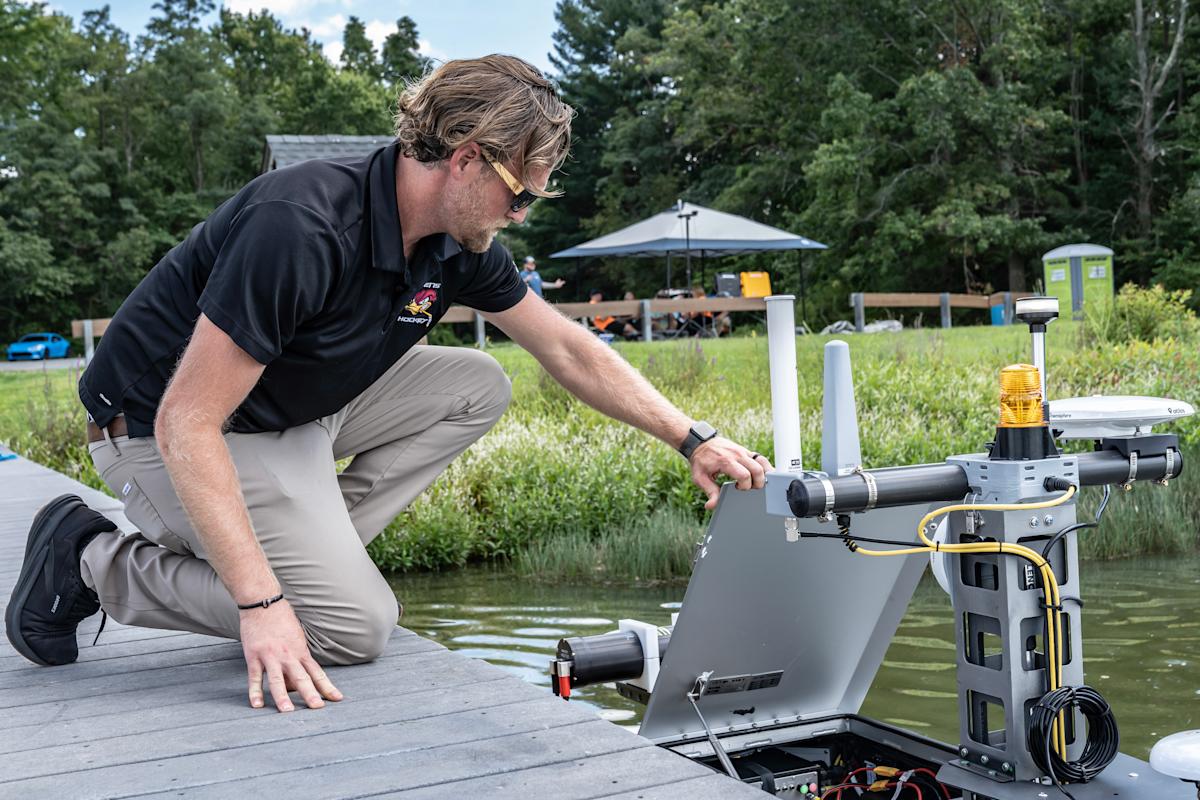 Matthew Janssen checks the WAM-V 8 before sending it off to survey the water. 