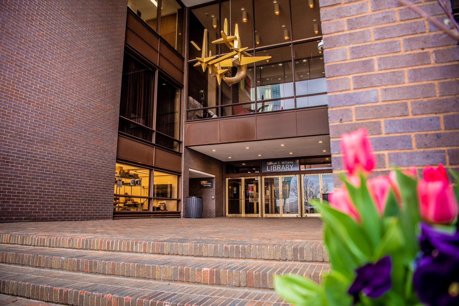 Exterior of the Samuel C. Williams Library photographed at night 