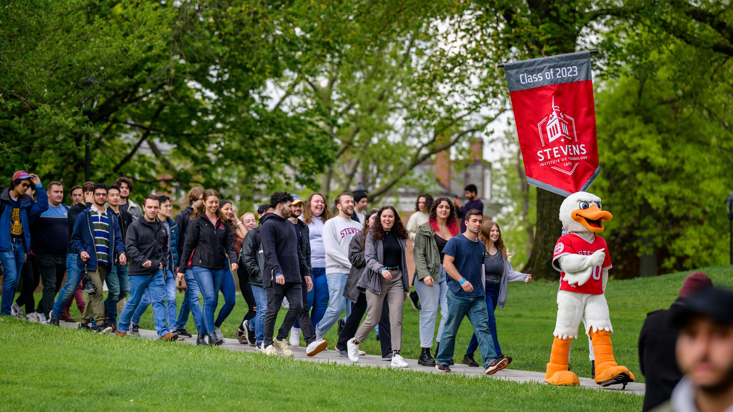 Seniors walking on Wittpenn Walk, led by Attila