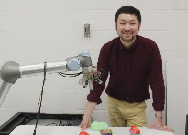 Long Wang with robotic hand