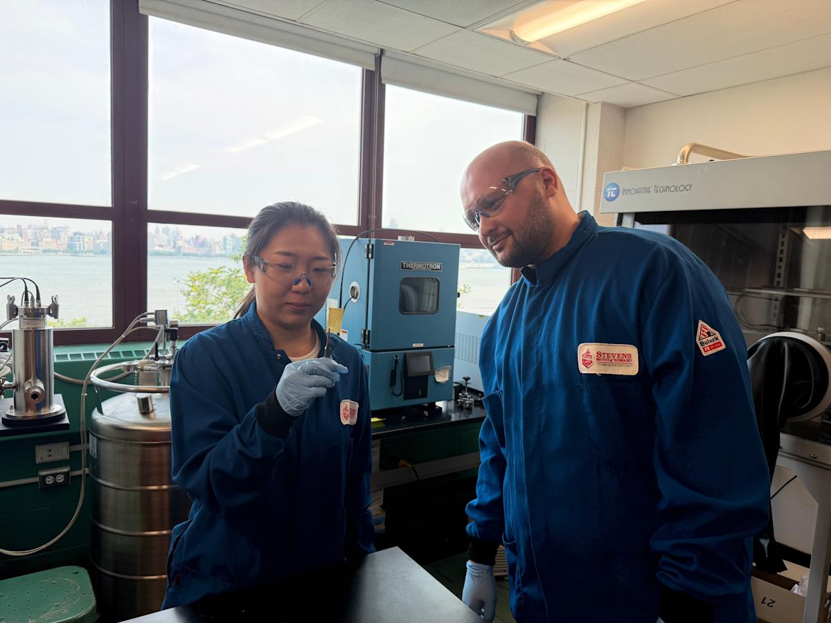 A Stevens researcher and professor Benjamin Paren examine a test result in a Stevens lab.