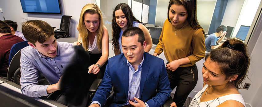 students around a computer