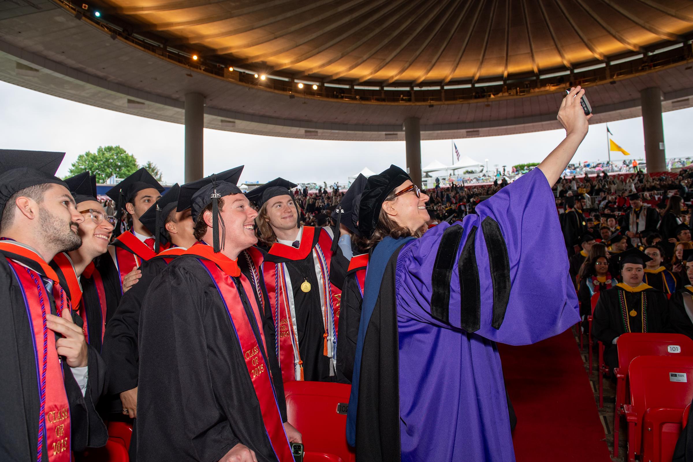 Sara Klein takes a selfie with several students.