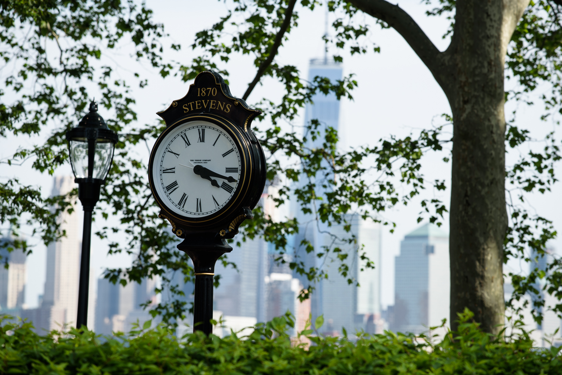 Photo of Stevens Clock with NYC skyline in the background