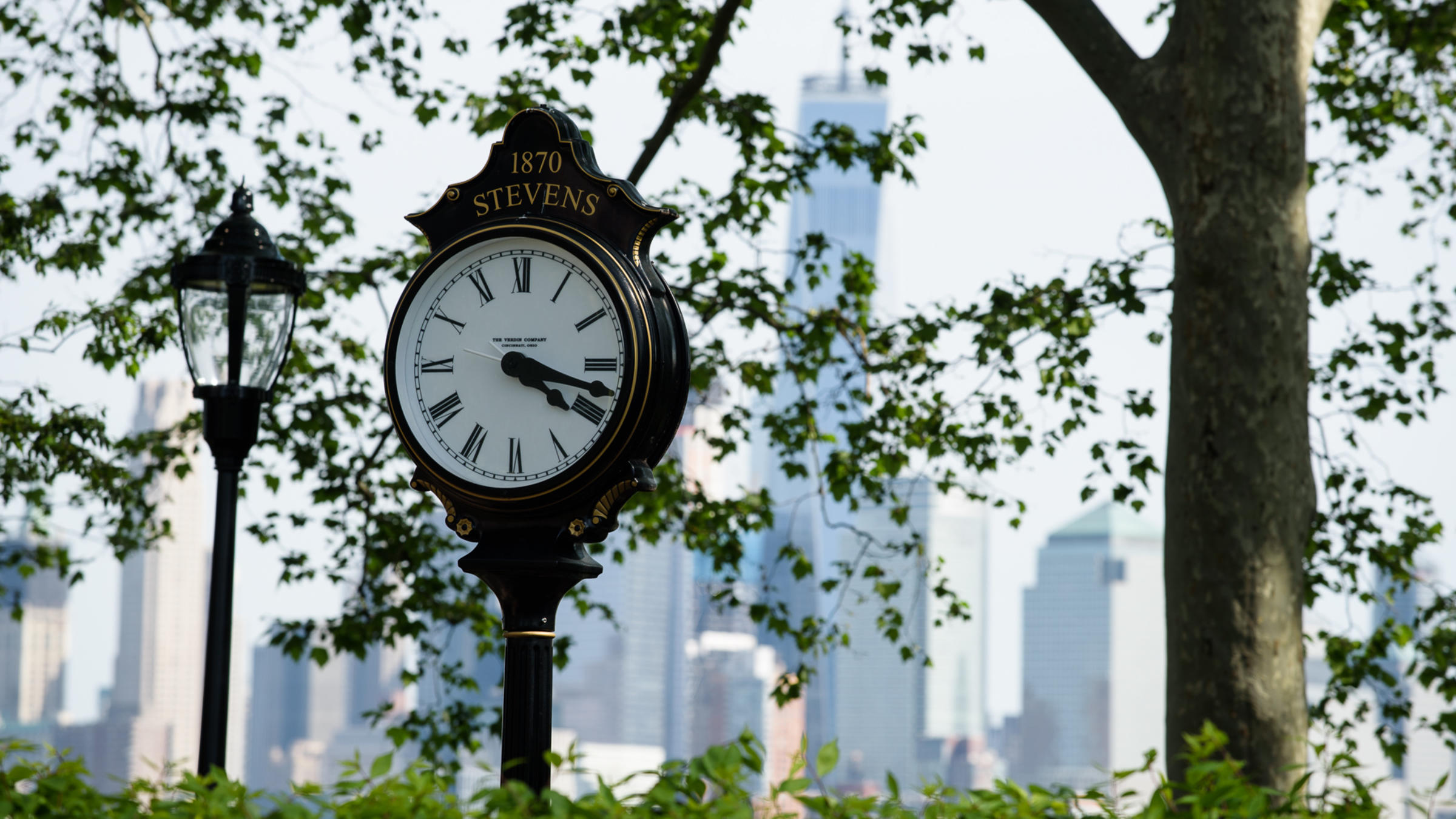 Photo of Stevens Clock with NYC skyline in the background