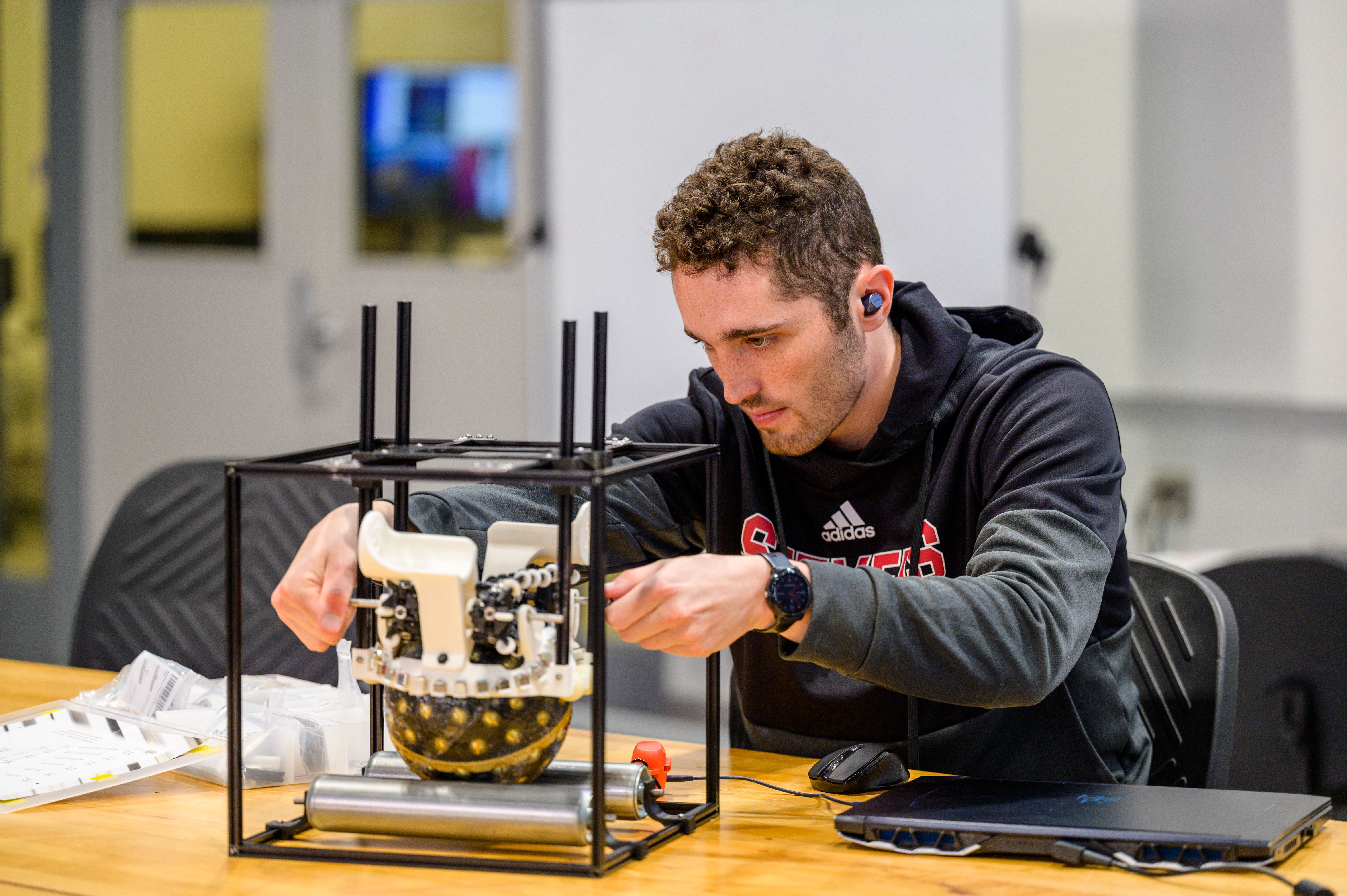 student working on robotics project