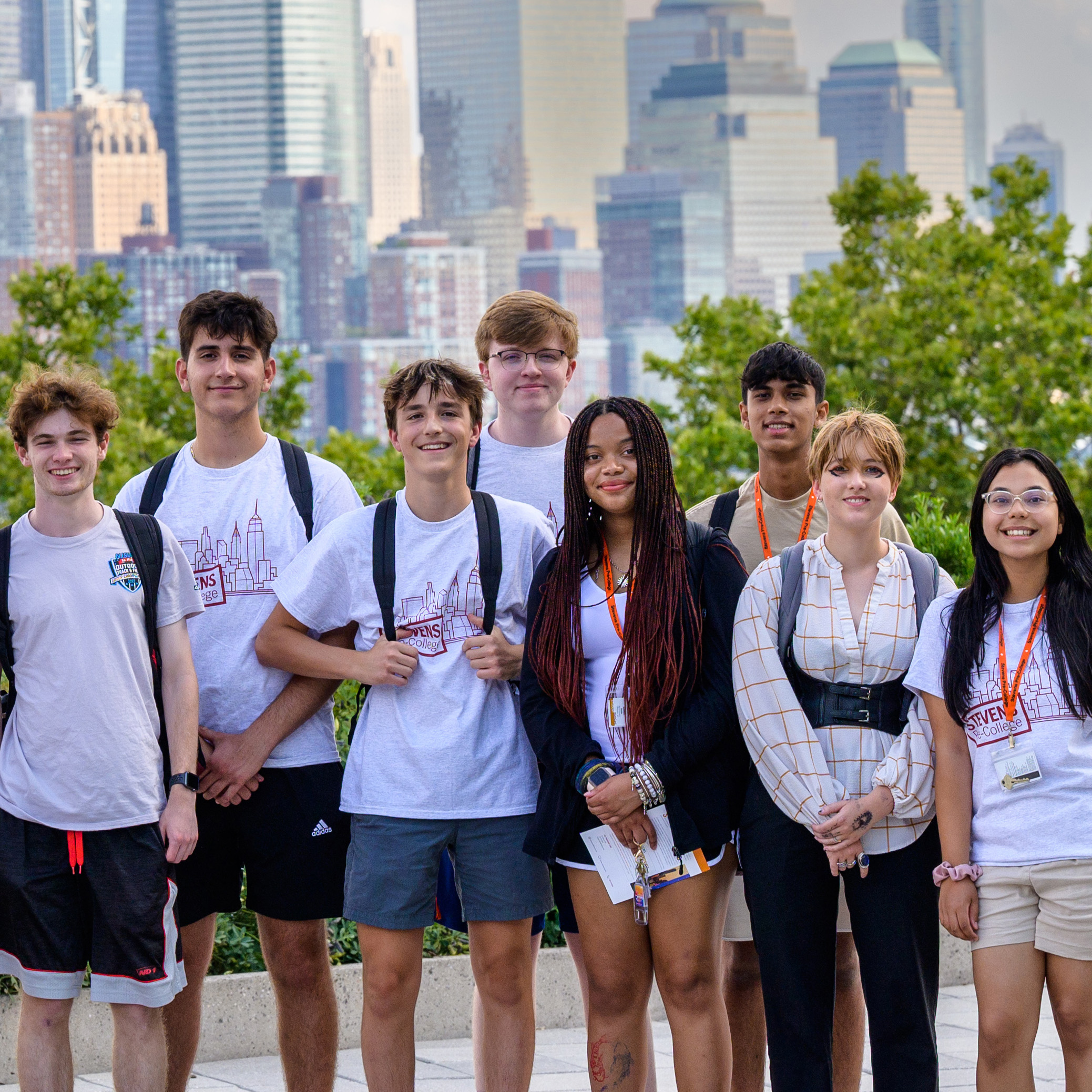 Pre-College students stand across river from New York City.