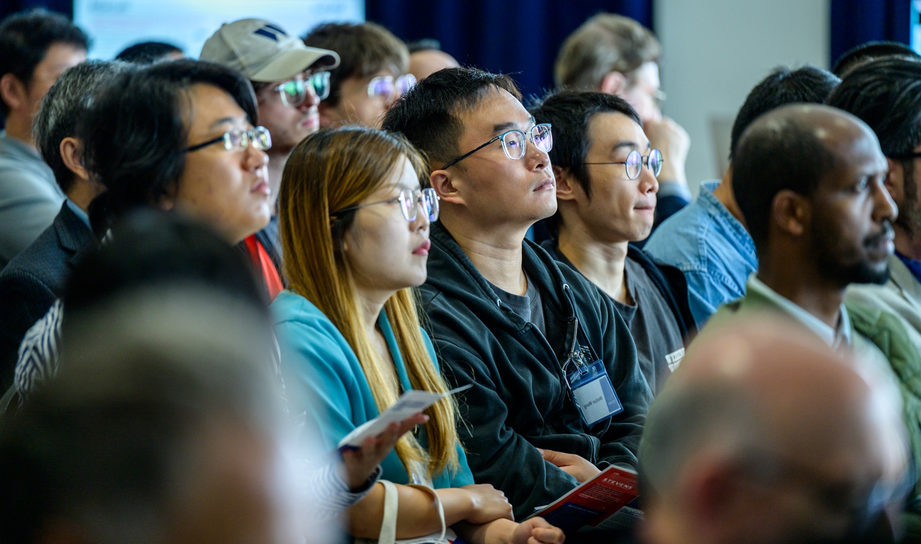 Audience members seated during a presentation at the iCNS Launch.
